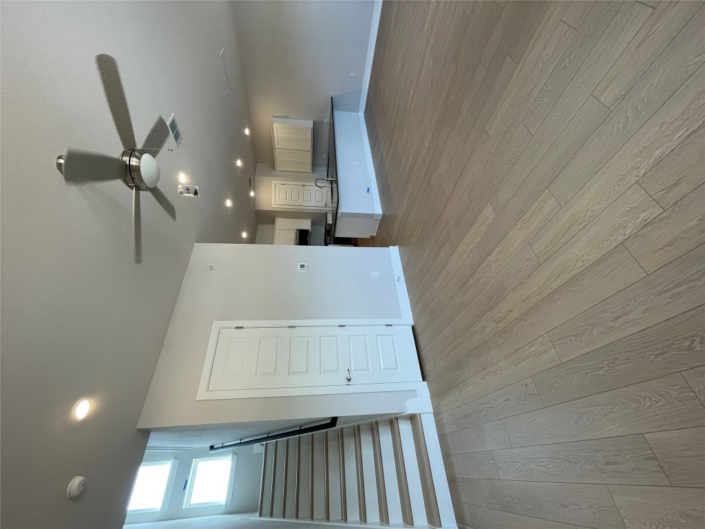 4701 Wally Avenue, Unit A Austin, TX 78721 - Photo 3 of 35 an empty room with wooden floor hallway and entryway