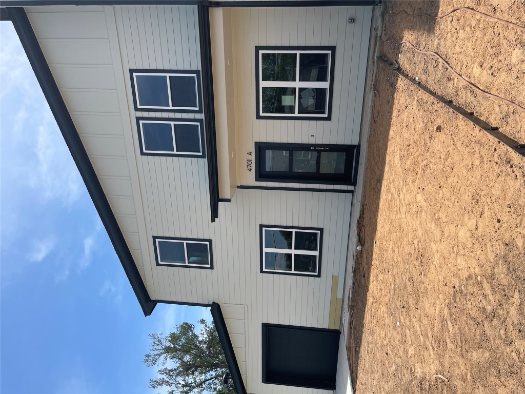 4701 Wally Avenue, Unit A Austin, TX 78721 - Photo 7 of 35 a front view of a house with a yard