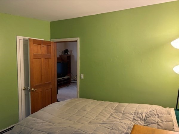 5 Island Road Lunenburg, MA 01462 - Photo 10 of 19 a bedroom with a bed and a table