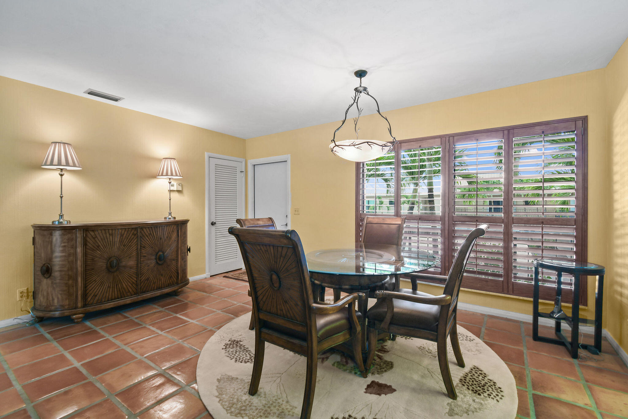 3 Southeast Turtle Creek Drive, Unit E Tequesta, FL 33469 - Photo 12 of 51 a view of a dining room with furniture window and outside view