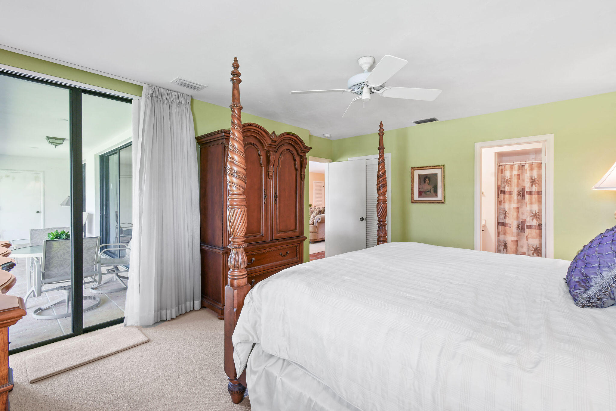 3 Southeast Turtle Creek Drive, Unit E Tequesta, FL 33469 - Photo 16 of 51 a bedroom with a bed dresser and a window