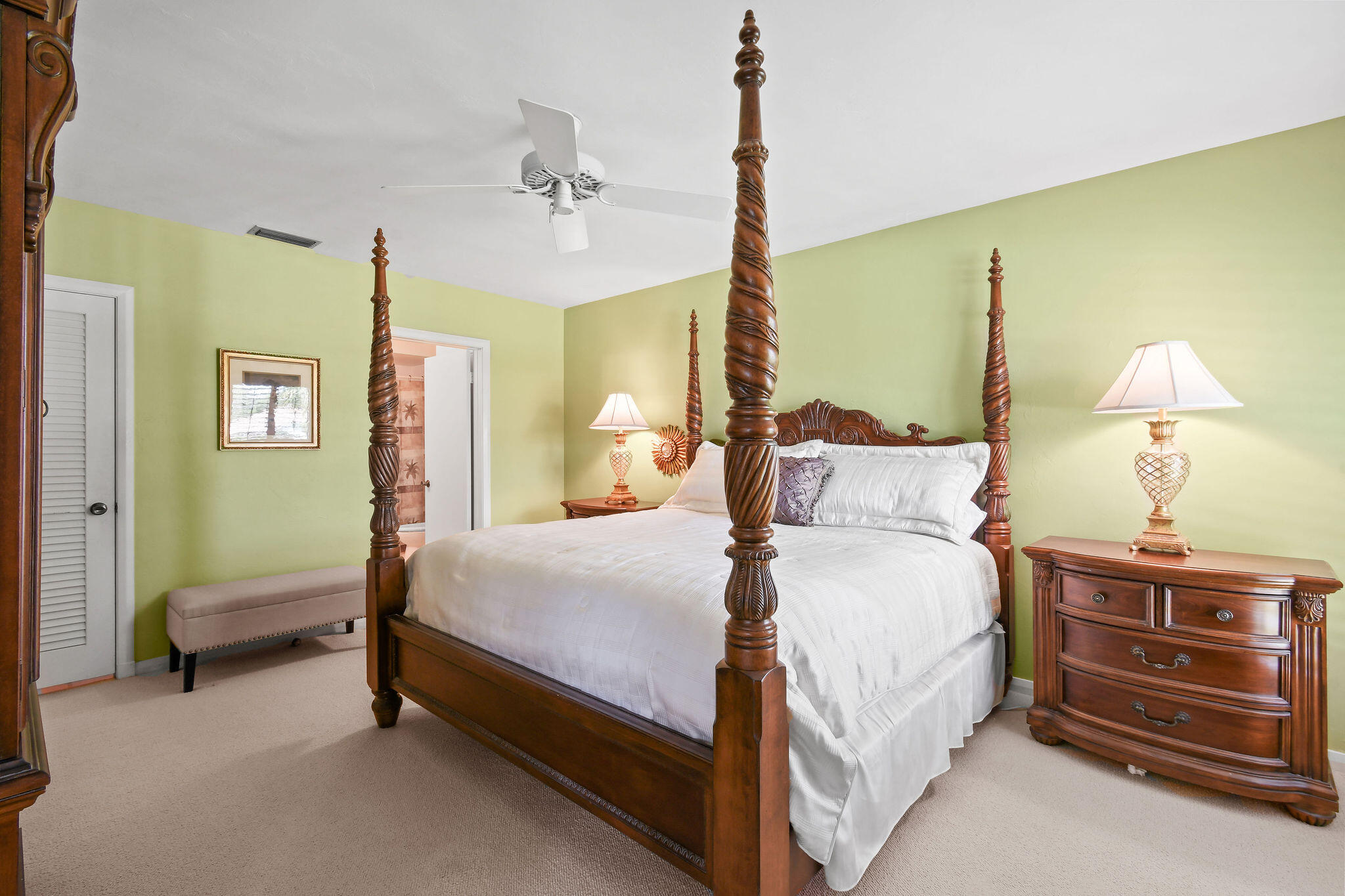 3 Southeast Turtle Creek Drive, Unit E Tequesta, FL 33469 - Photo 17 of 51 a bedroom with a bed and a chandelier