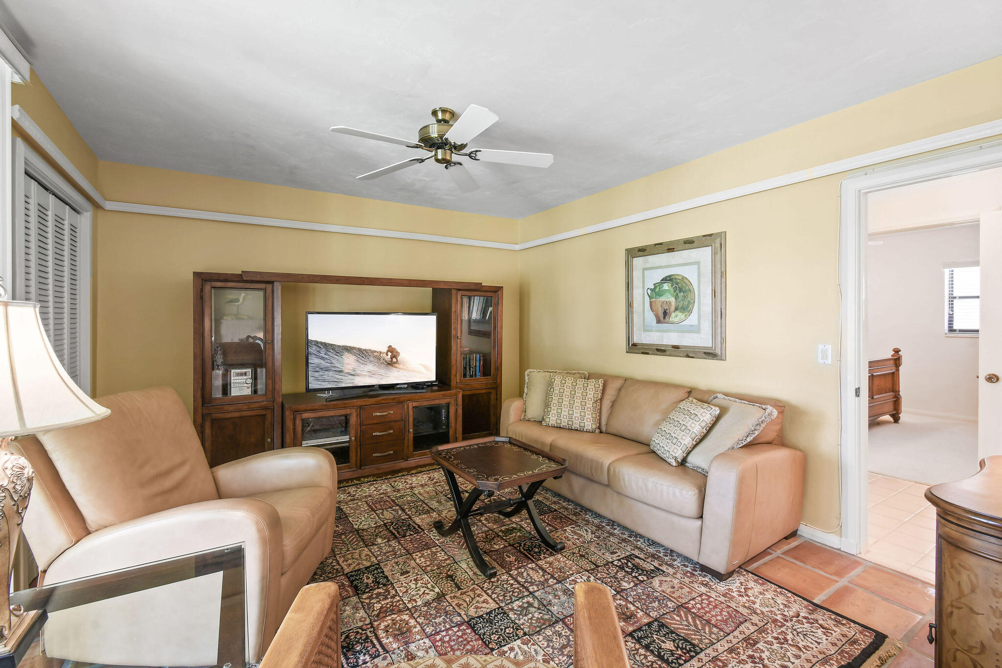 3 Southeast Turtle Creek Drive, Unit E Tequesta, FL 33469 - Photo 25 of 51 a living room with furniture and a flat screen tv