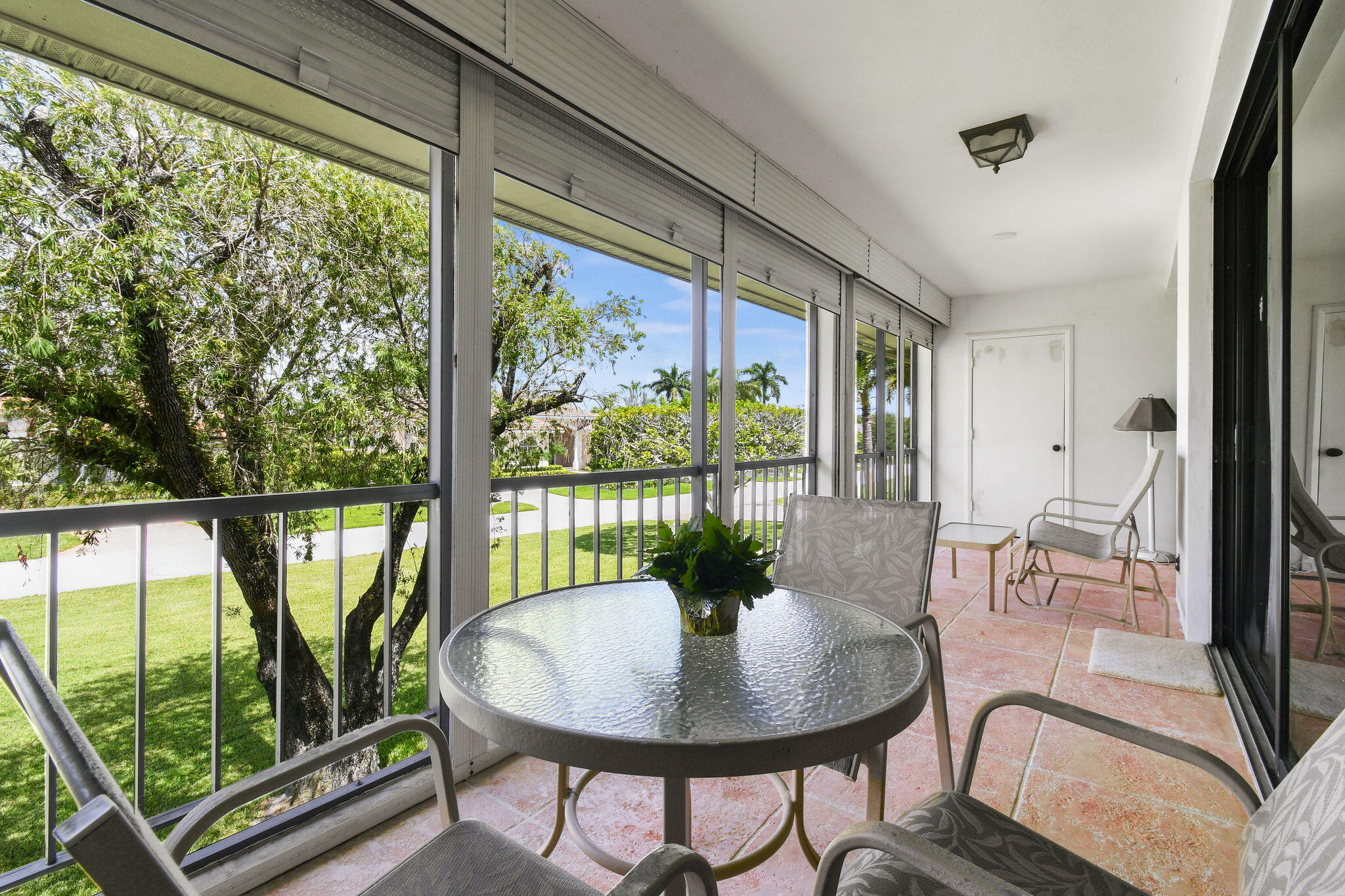 3 Southeast Turtle Creek Drive, Unit E Tequesta, FL 33469 - Photo 28 of 51 a dining room with furniture a fireplace and wooden floor