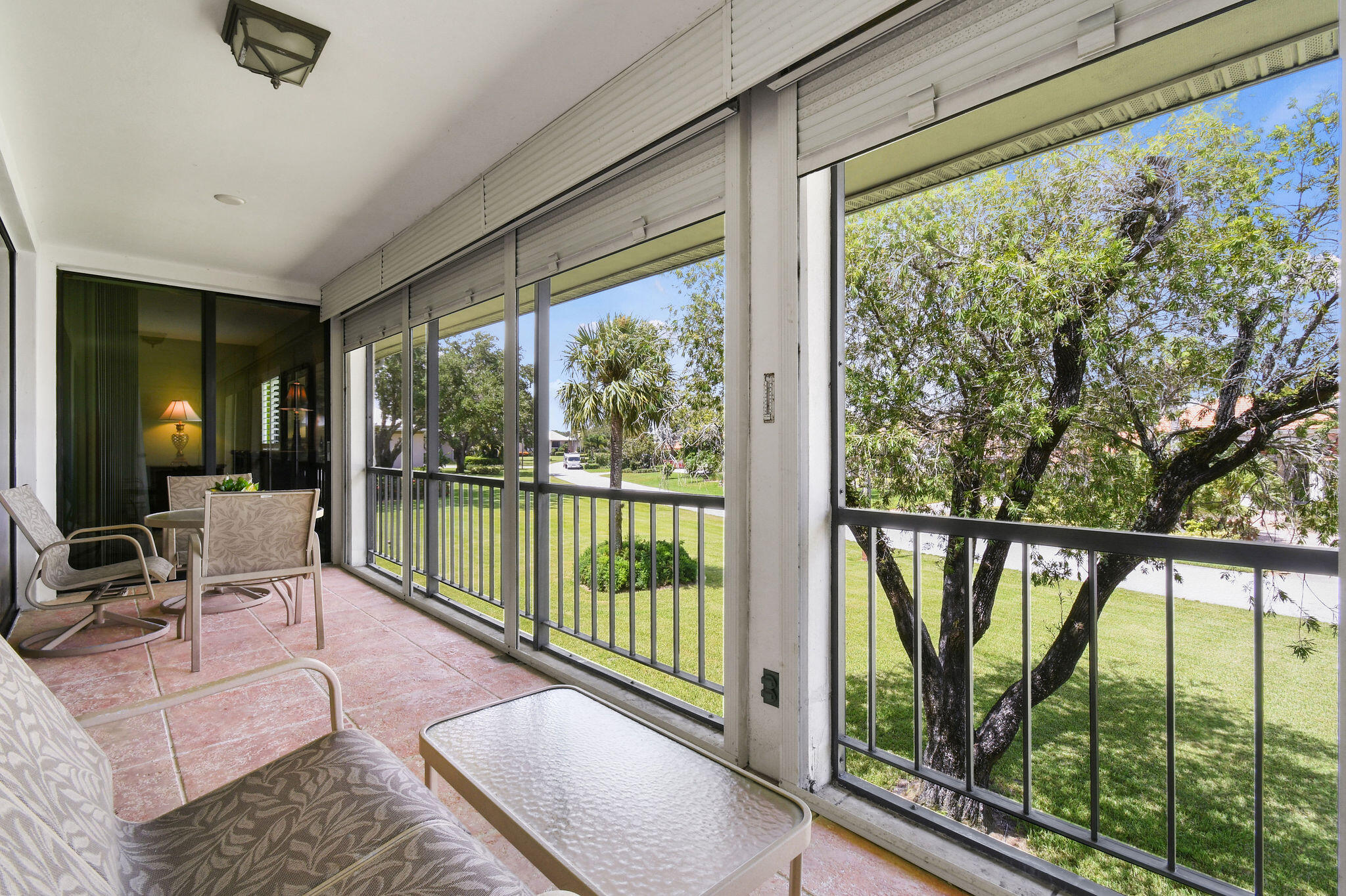 3 Southeast Turtle Creek Drive, Unit E Tequesta, FL 33469 - Photo 29 of 51 a living room with furniture and floor to ceiling windows