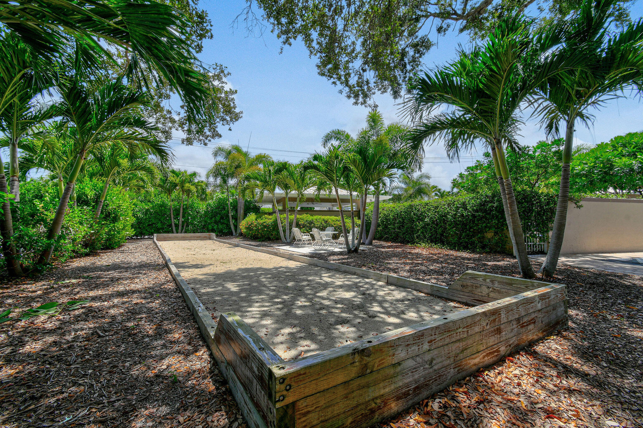 3 Southeast Turtle Creek Drive, Unit E Tequesta, FL 33469 - Photo 36 of 51 a view of a backyard with a barn