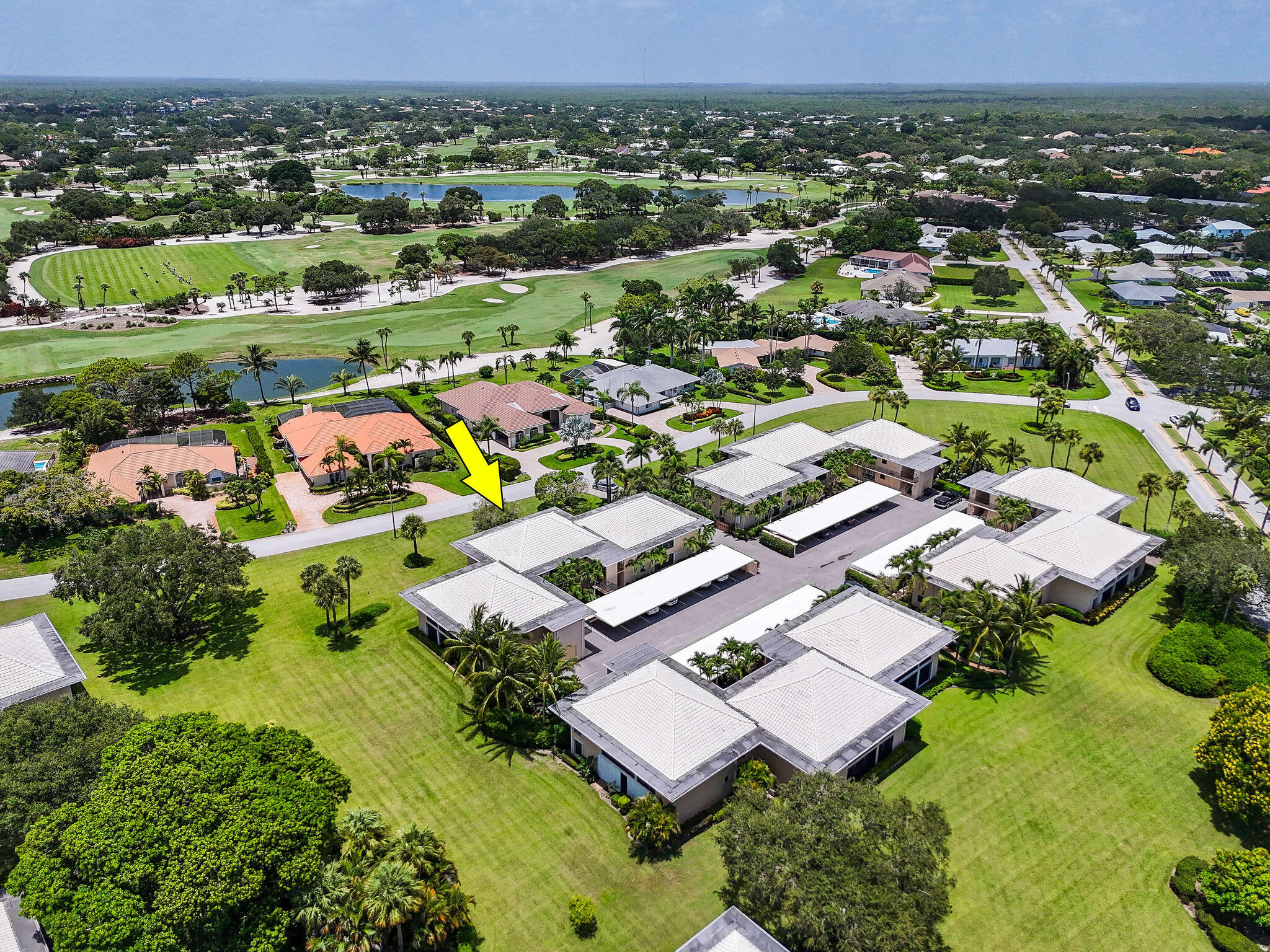 3 Southeast Turtle Creek Drive, Unit E Tequesta, FL 33469 - Photo 38 of 51 an aerial view of residential houses with outdoor space and parking