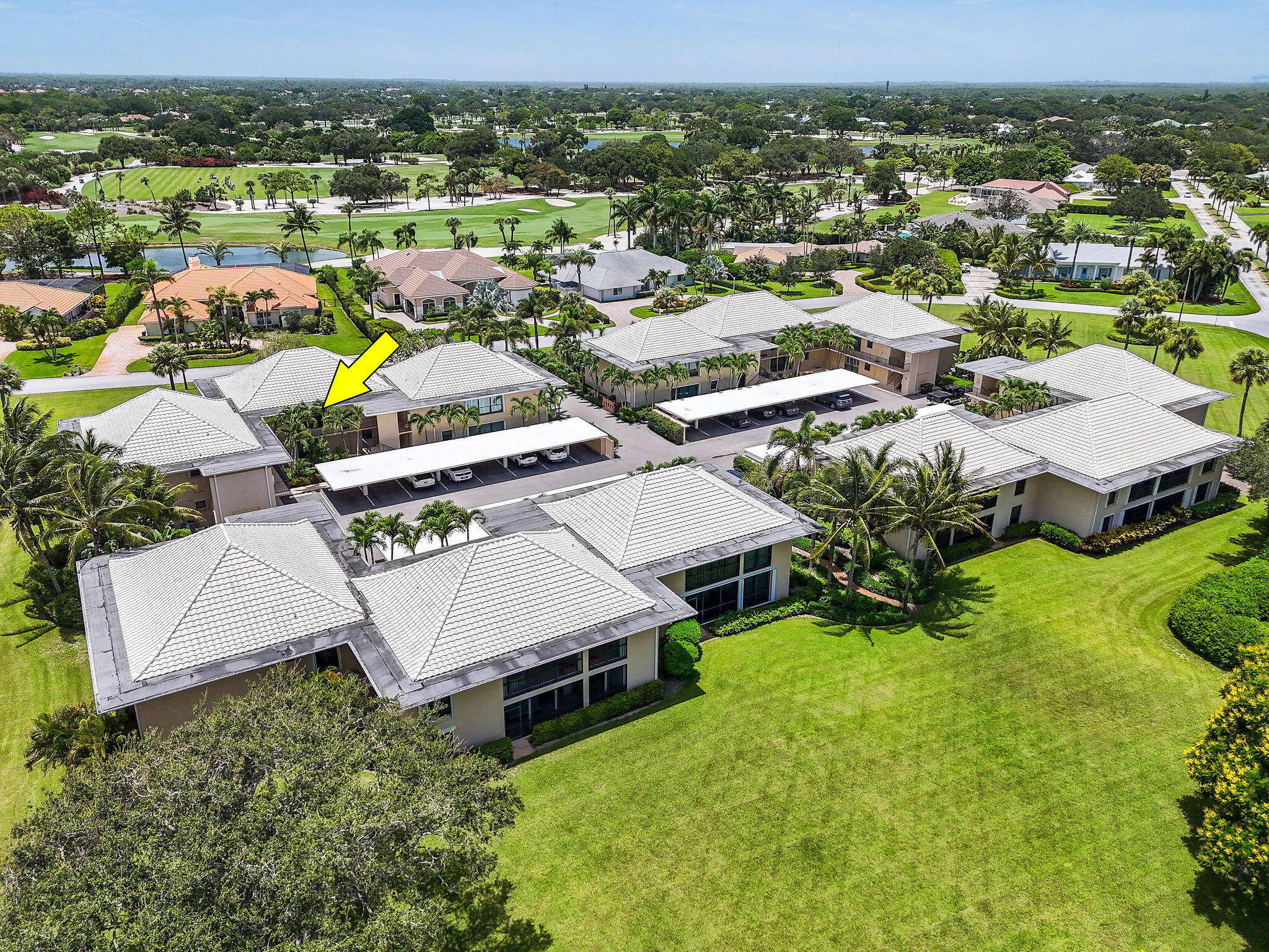 3 Southeast Turtle Creek Drive, Unit E Tequesta, FL 33469 - Photo 41 of 51 an aerial view of a house with a big yard