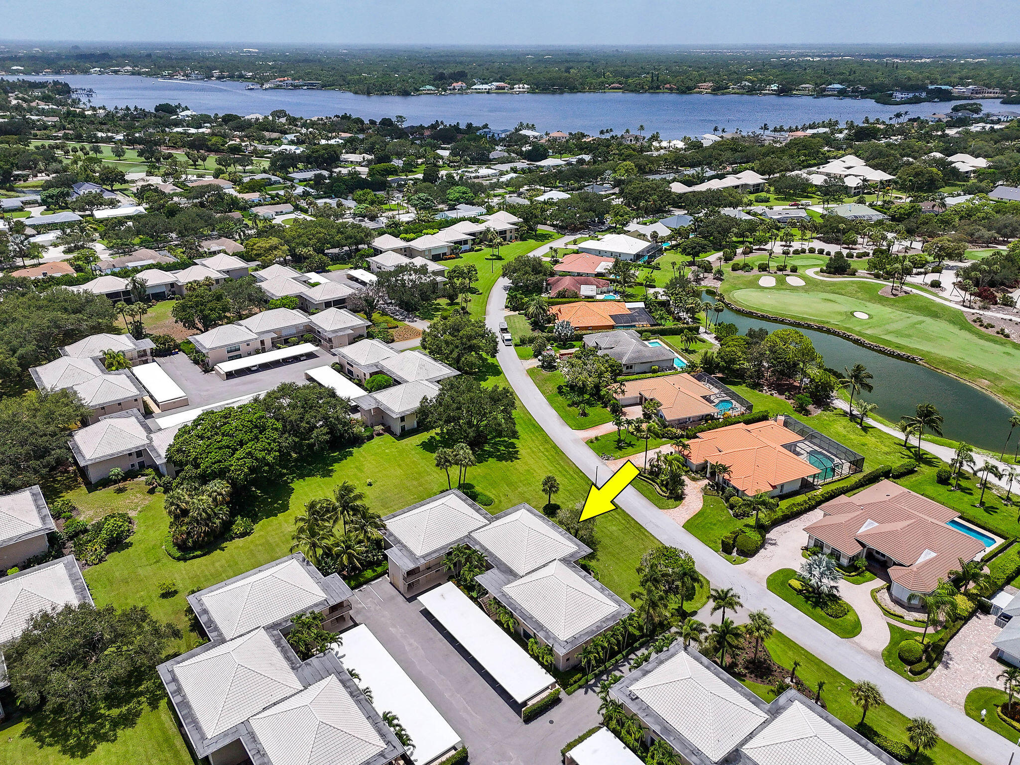 3 Southeast Turtle Creek Drive, Unit E Tequesta, FL 33469 - Photo 44 of 51 an aerial view of residential houses with outdoor space
