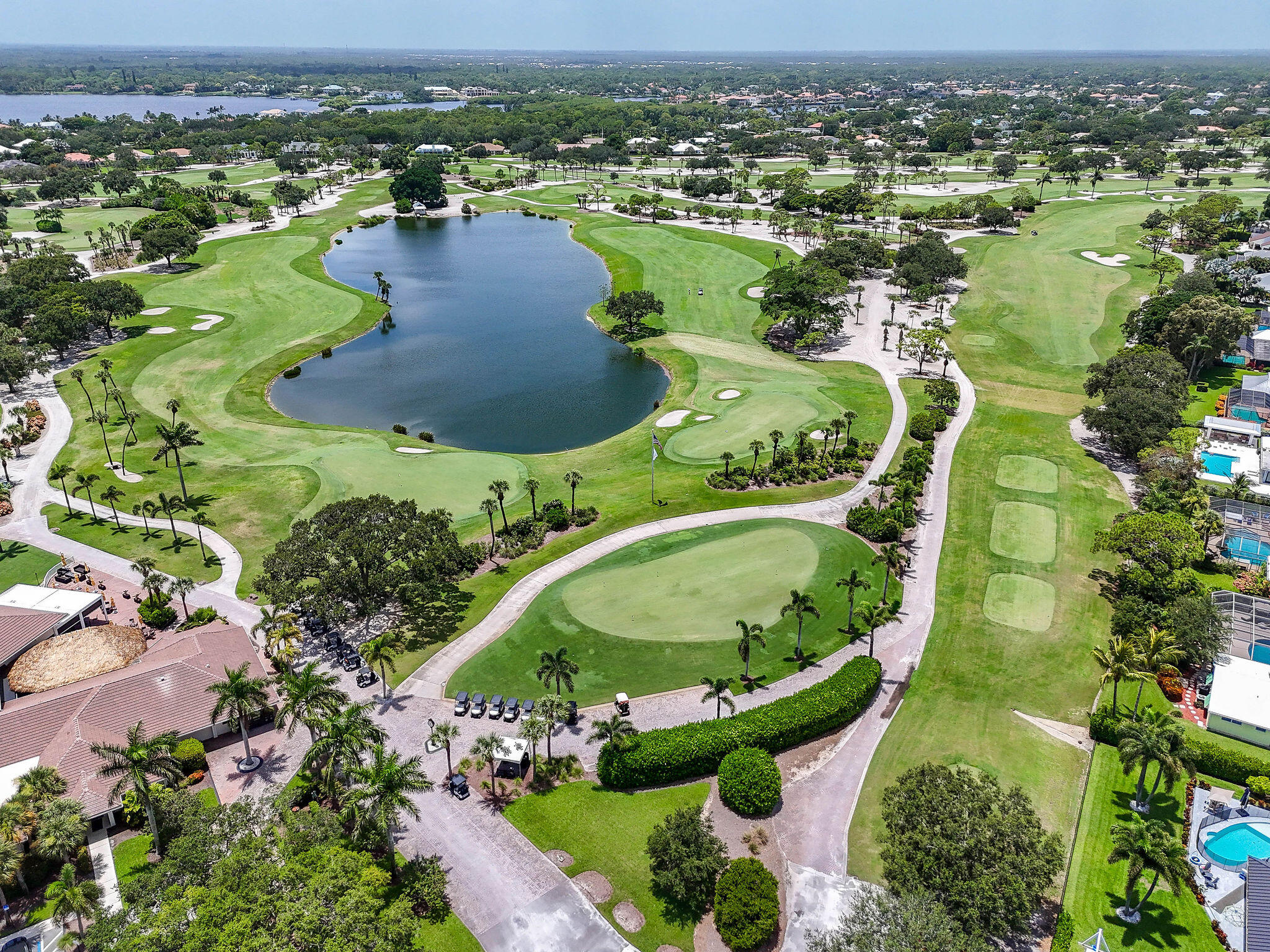 3 Southeast Turtle Creek Drive, Unit E Tequesta, FL 33469 - Photo 49 of 51 an aerial view of residential houses with outdoor space and lake view