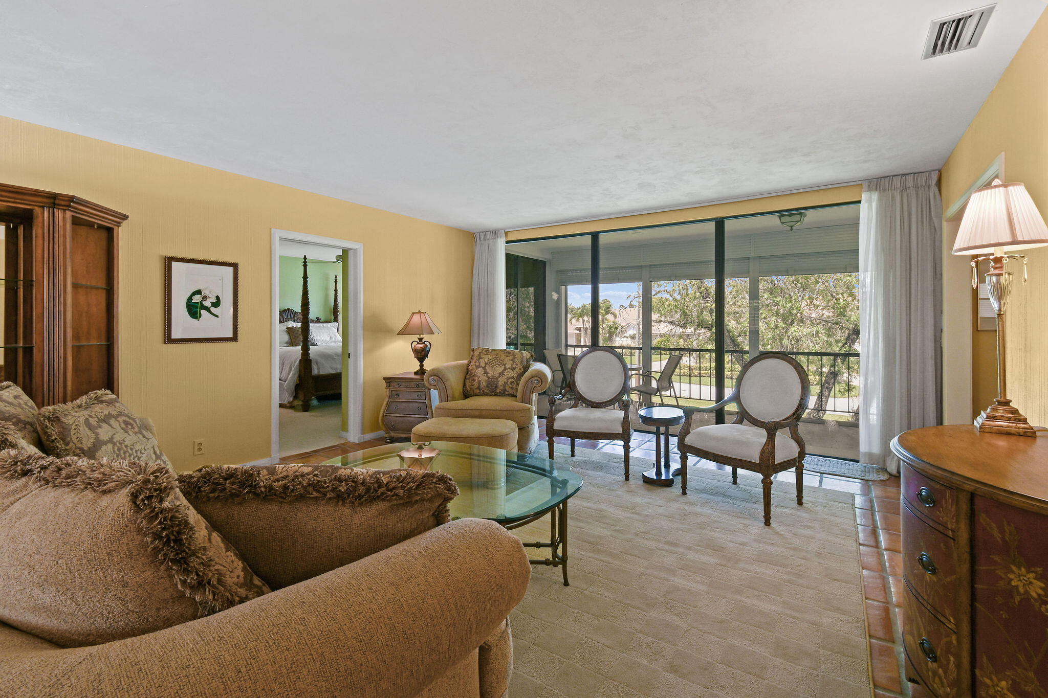 3 Southeast Turtle Creek Drive, Unit E Tequesta, FL 33469 - Photo 10 of 51 a living room with furniture and a large window