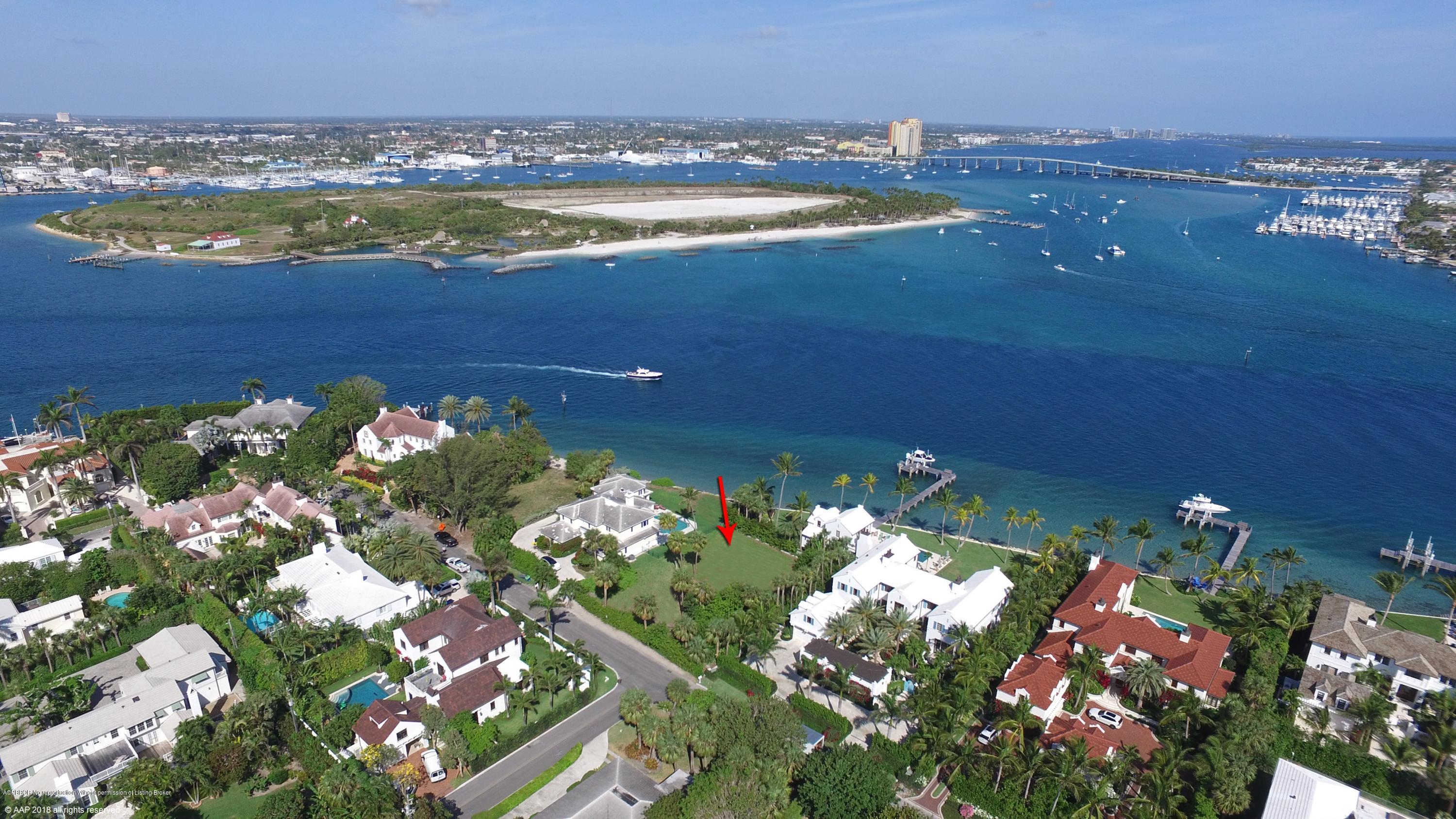 Na Indian Road Palm Beach, FL 33480 - Photo 2 of 4 a view of a lake with a building in the background