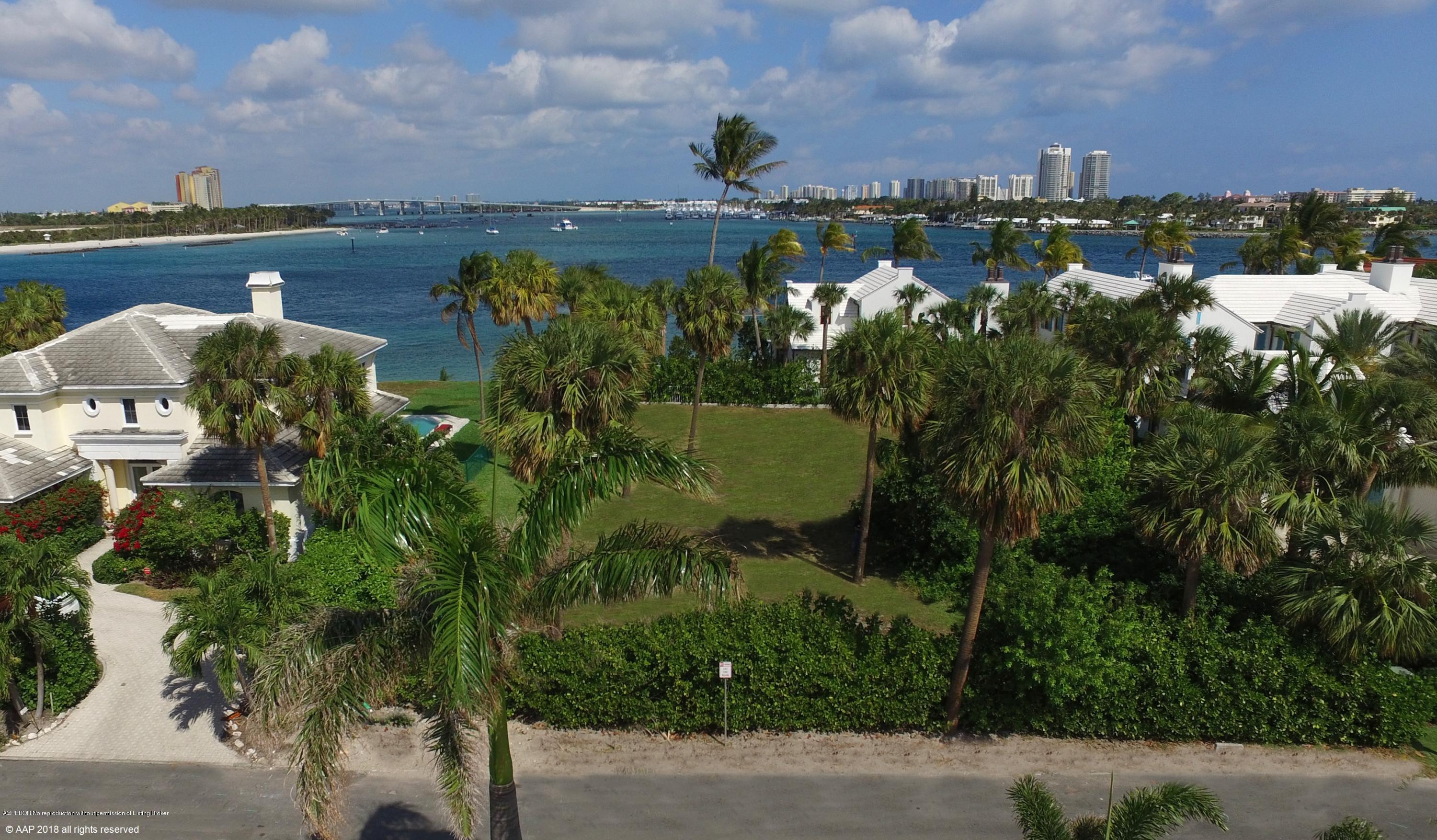 Na Indian Road Palm Beach, FL 33480 - Photo 3 of 4 an aerial view of a houses with a yard and lake view