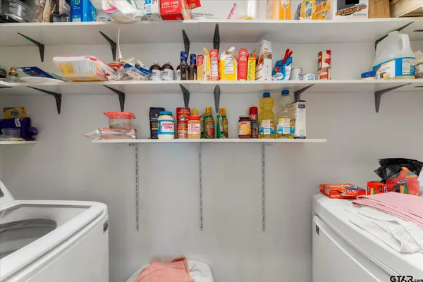 a storage room with washer and dryer