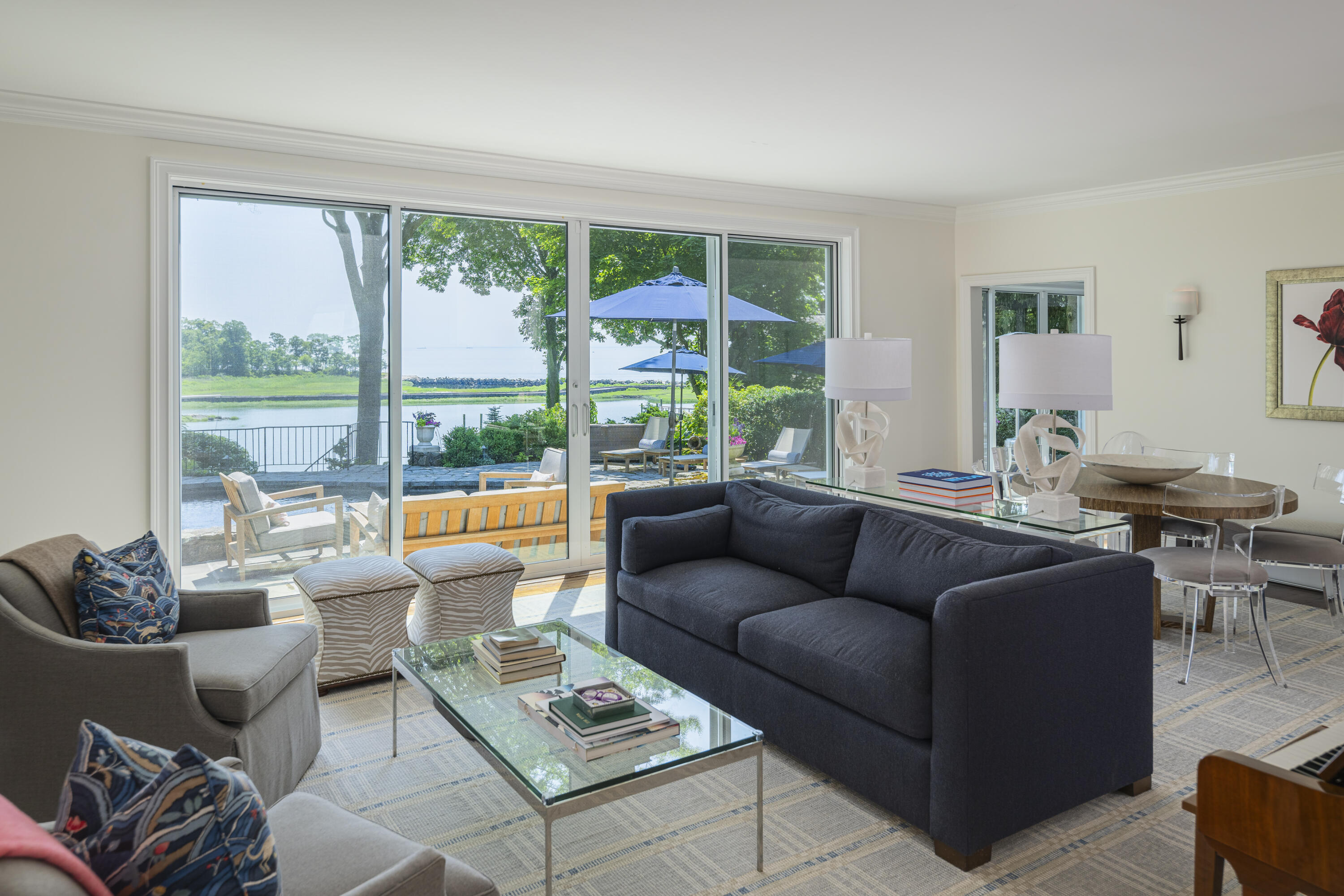 123 Long Neck Point Road Darien, CT 06820 - Photo 11 of 40 a living room with furniture and a large window