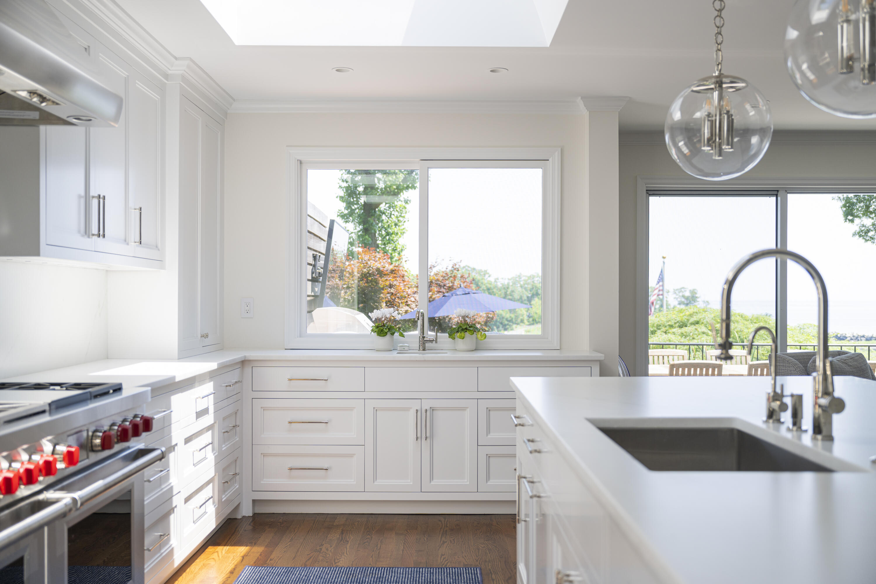 123 Long Neck Point Road Darien, CT 06820 - Photo 14 of 40 a kitchen with a sink cabinets and window