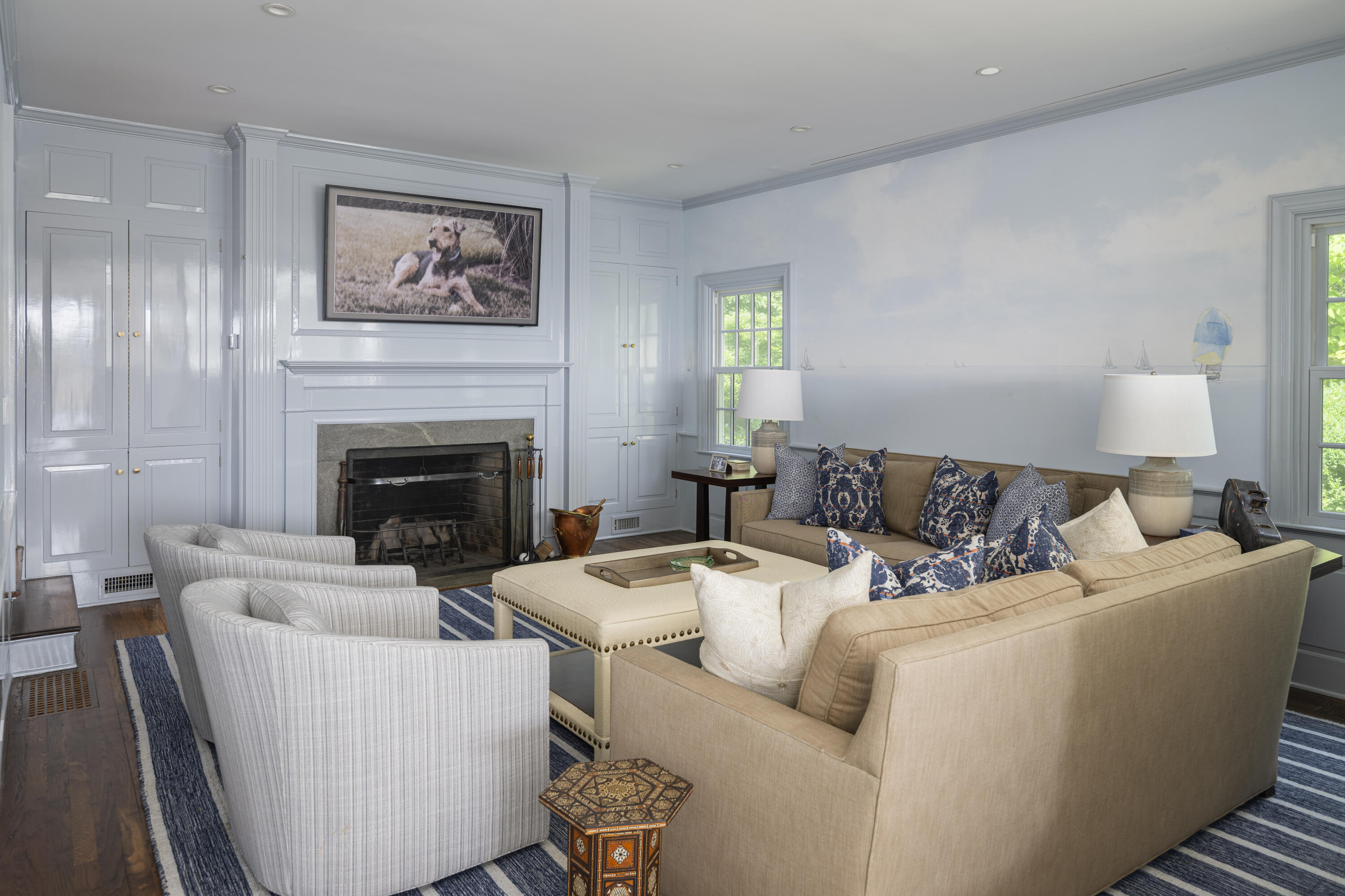 123 Long Neck Point Road Darien, CT 06820 - Photo 17 of 40 a living room with furniture and a fireplace