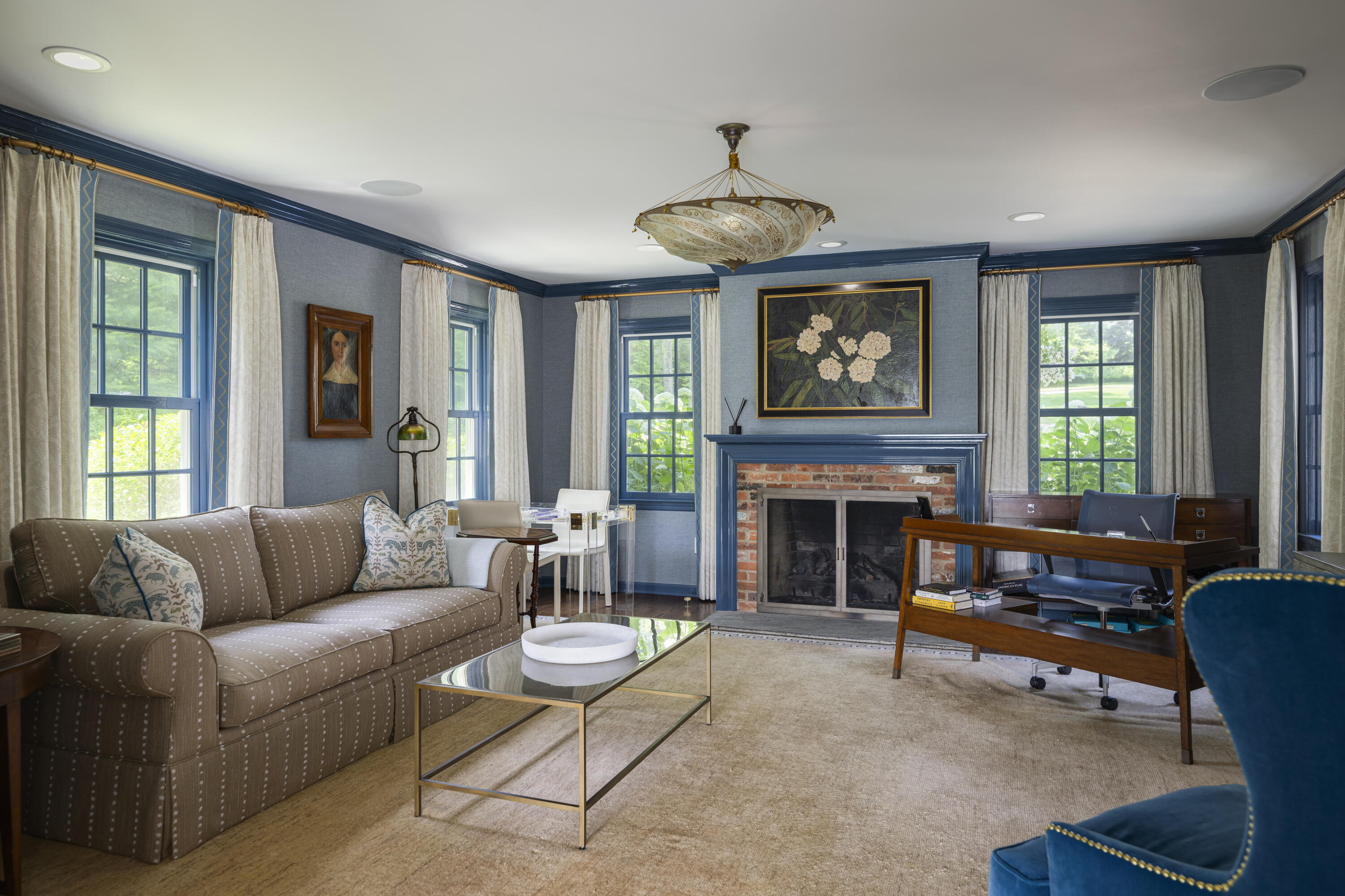 123 Long Neck Point Road Darien, CT 06820 - Photo 20 of 40 a living room with furniture a fireplace and a large window