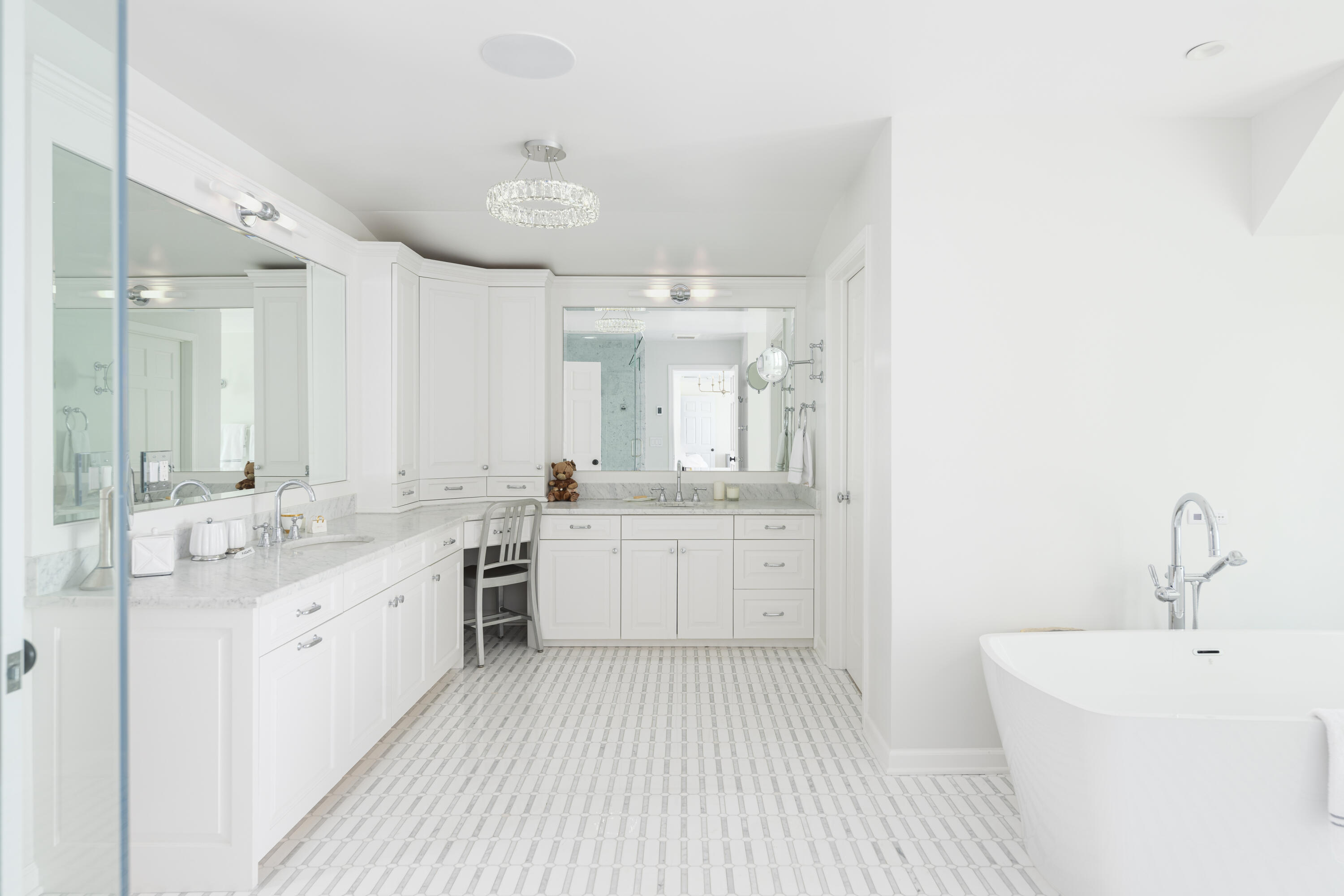 123 Long Neck Point Road Darien, CT 06820 - Photo 24 of 40 a large bathroom with a double vanity sink a mirror and a bathtub