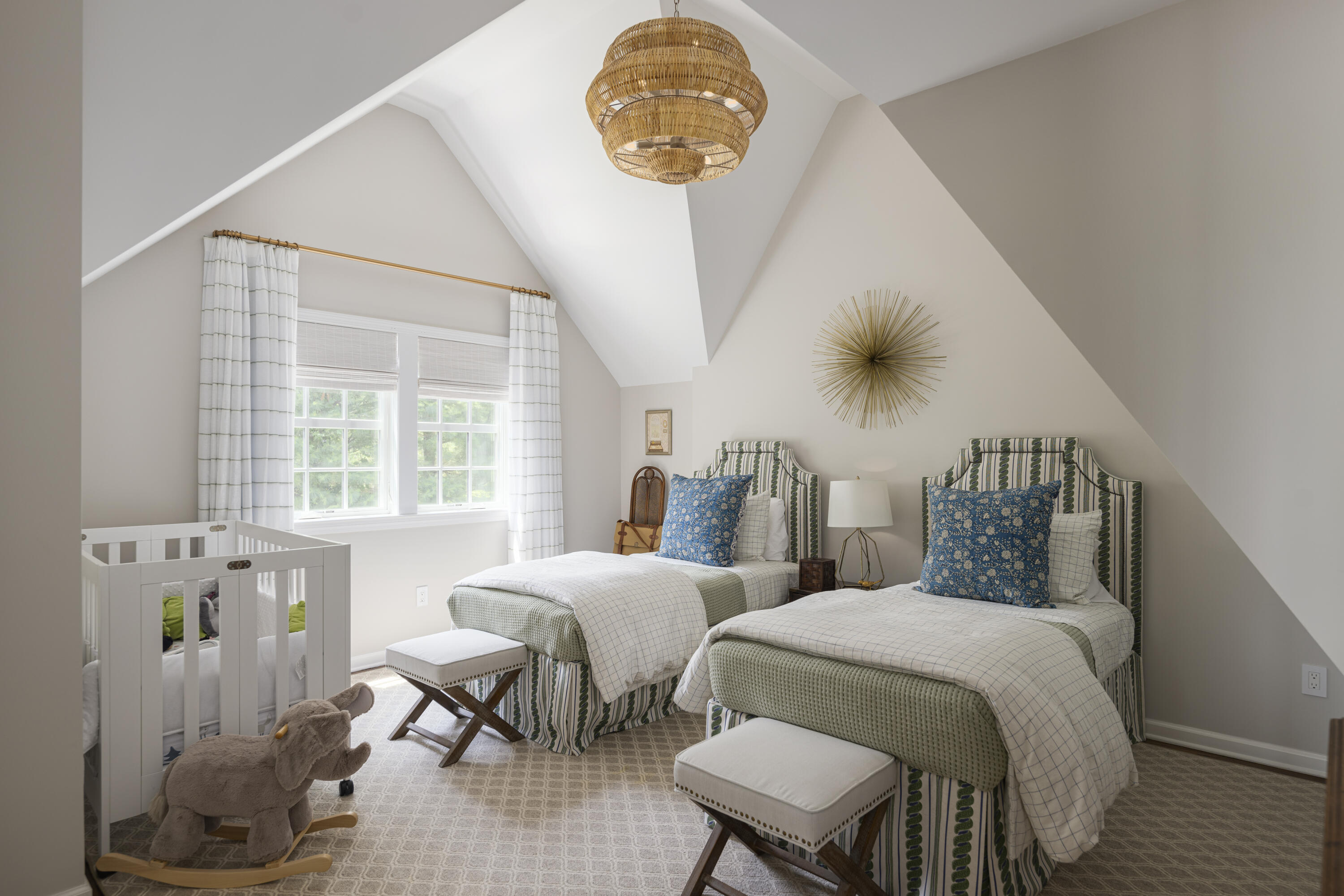 123 Long Neck Point Road Darien, CT 06820 - Photo 28 of 40 a bedroom with two beds and a chandelier