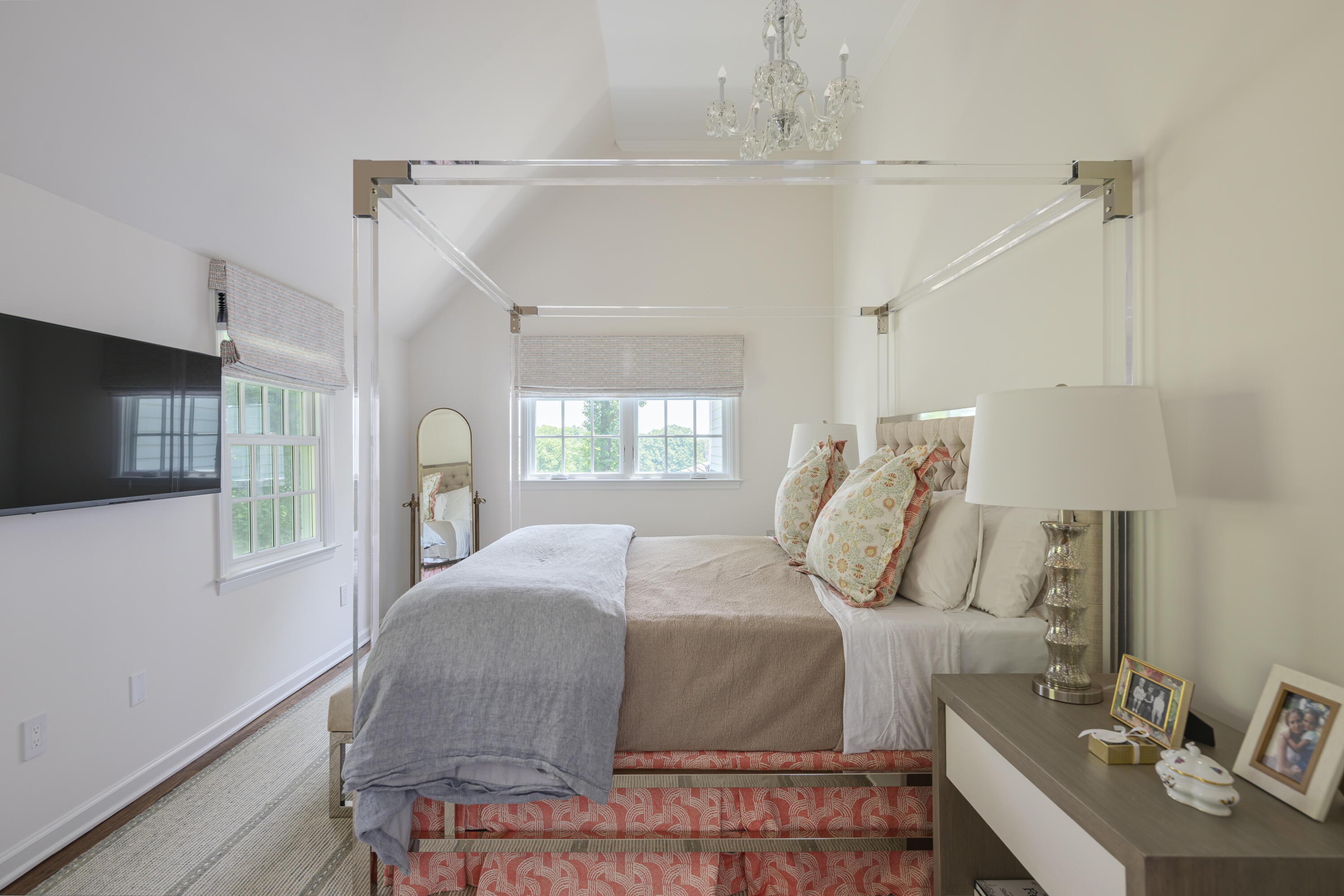 123 Long Neck Point Road Darien, CT 06820 - Photo 29 of 40 a bedroom with a bed a flat screen tv and a window