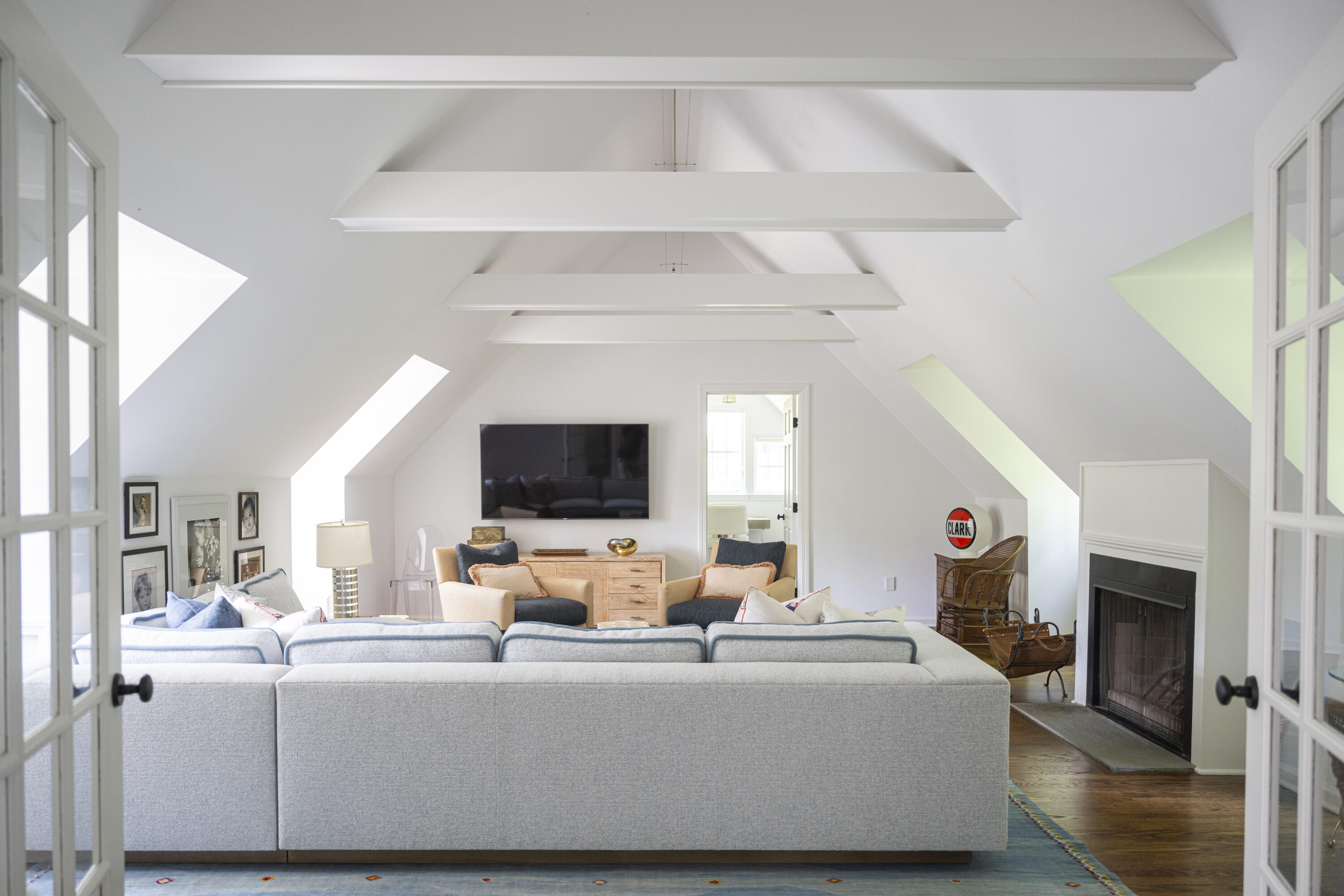 123 Long Neck Point Road Darien, CT 06820 - Photo 33 of 40 a living room with furniture and a flat screen tv