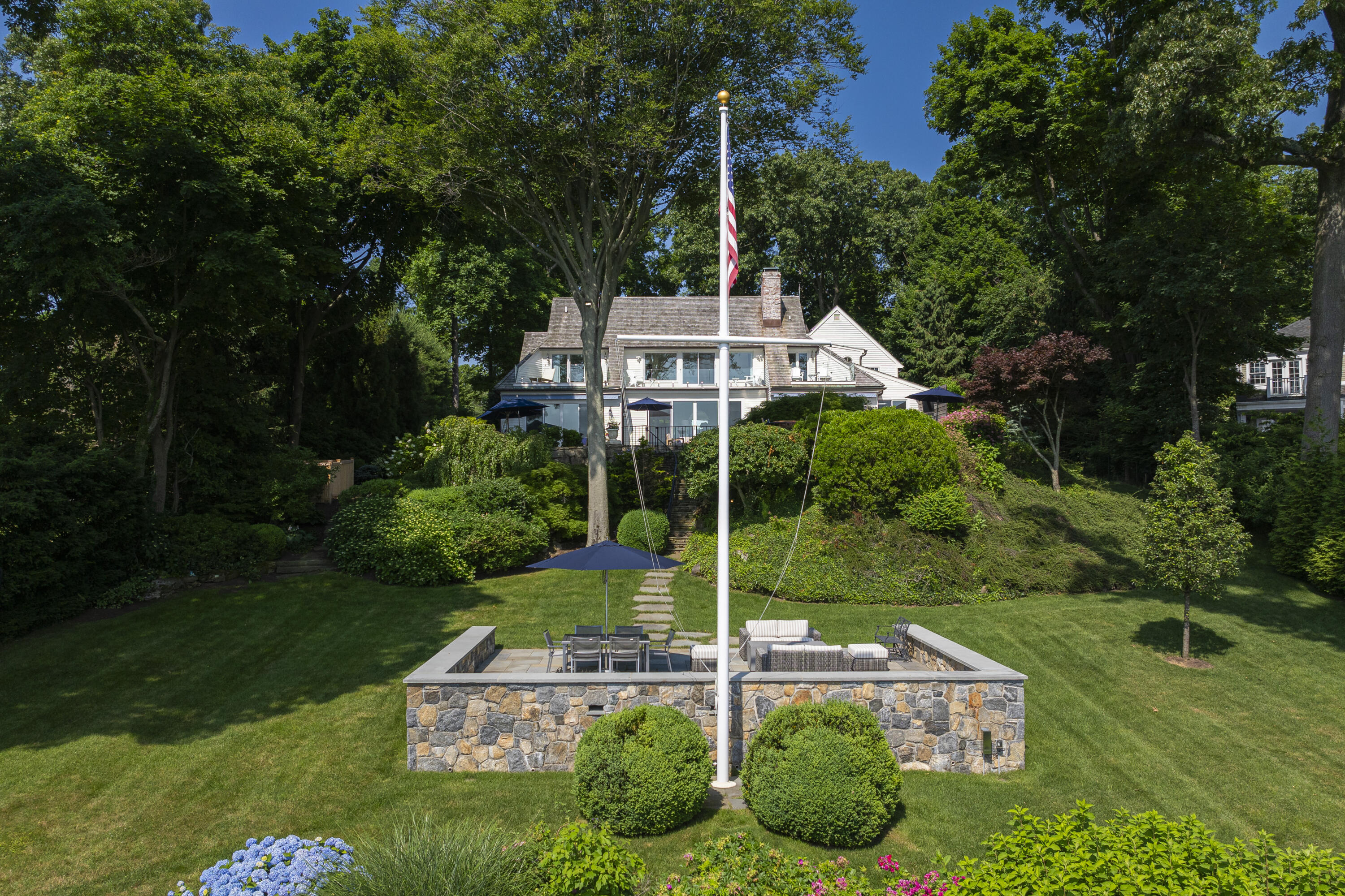 123 Long Neck Point Road Darien, CT 06820 - Photo 38 of 40 a front view of a house with a yard