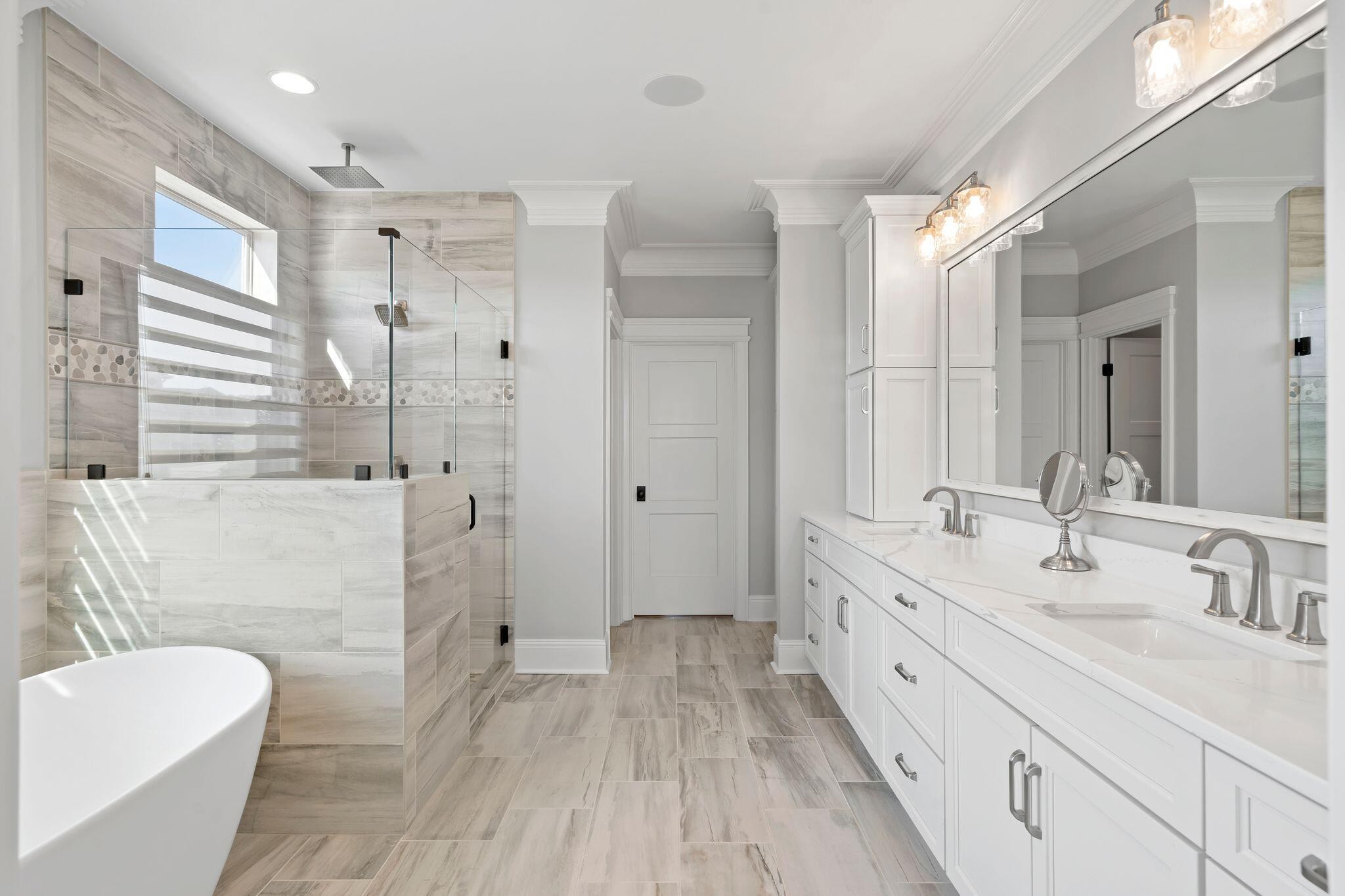4190 Split Rail Way Whiteside, TN 37396 - Photo 12 of 25 a bathroom with a double vanity sink toilet mirror and bathtub
