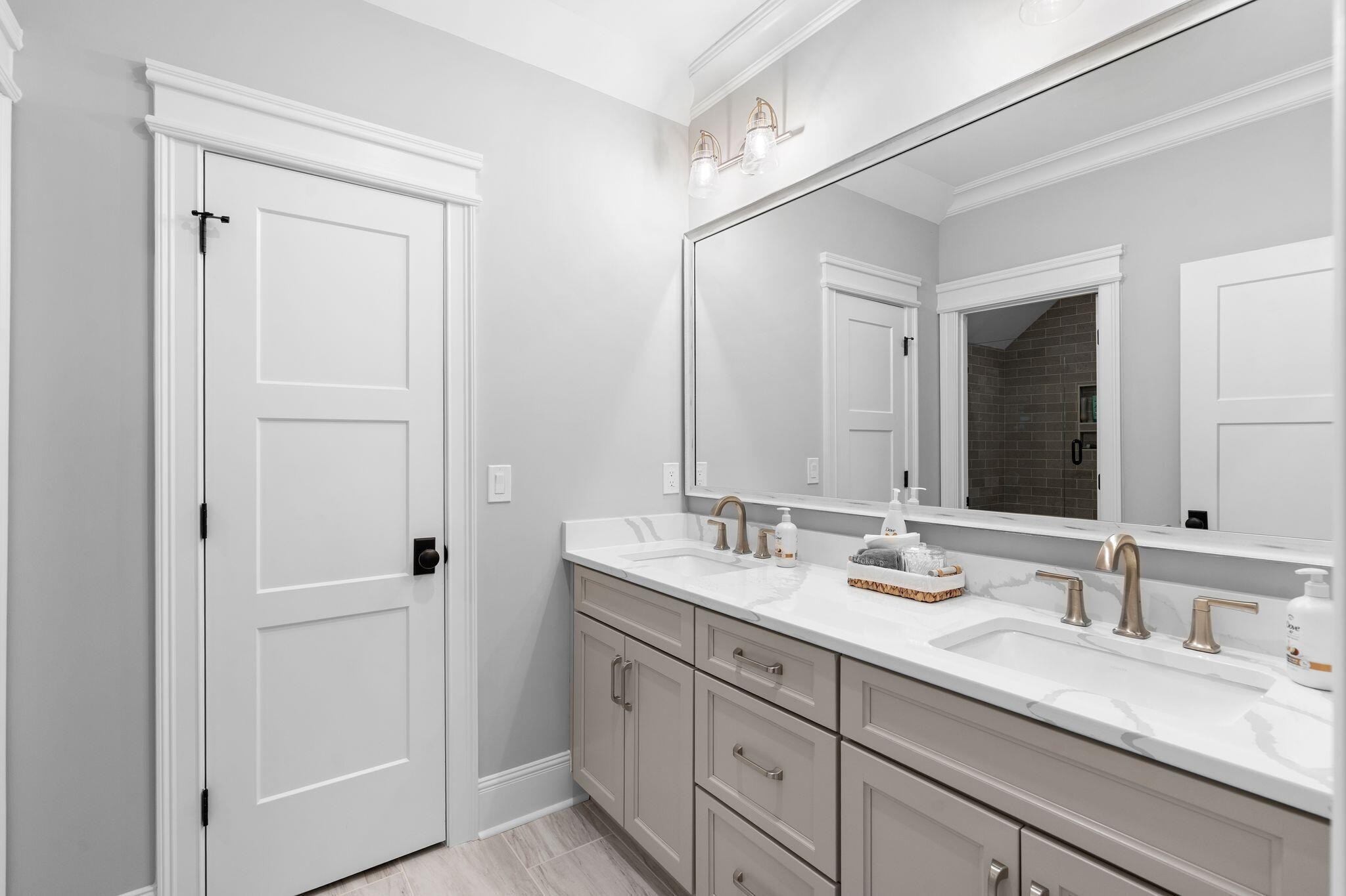 4190 Split Rail Way Whiteside, TN 37396 - Photo 21 of 25 a bathroom with a double vanity sink and a mirror