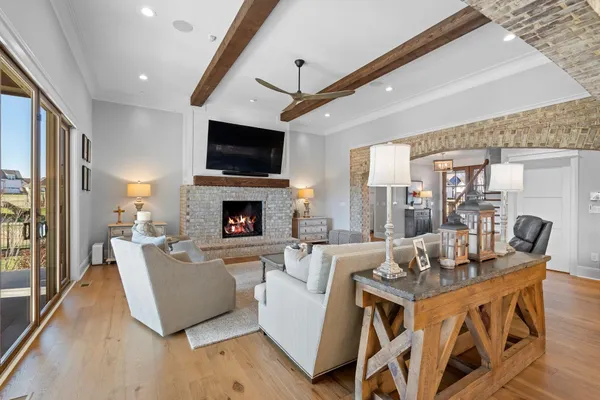 a living room with fireplace furniture and a flat screen tv