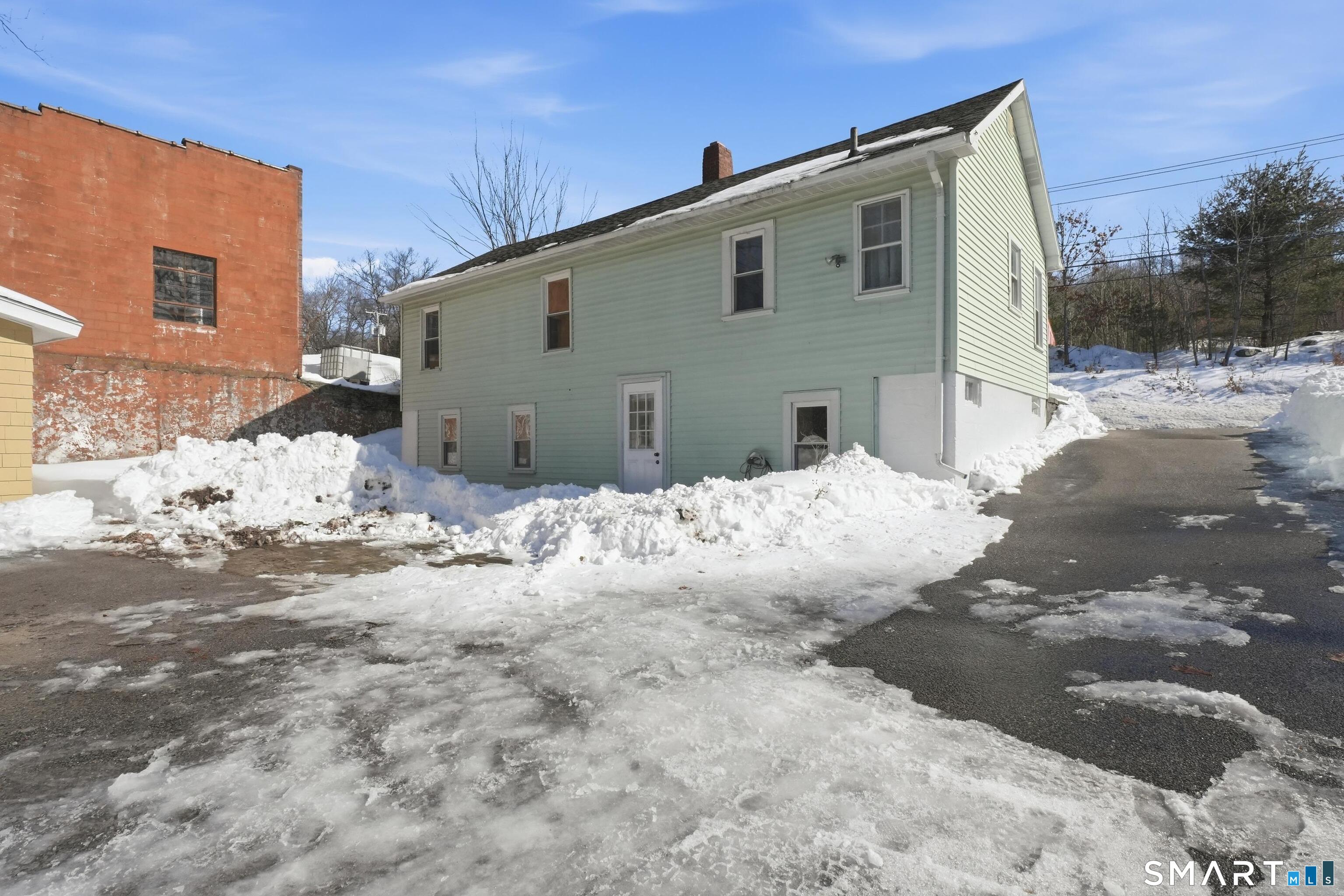 74 Riverside Drive Thompson, CT 06277 - Photo 14 of 25 a front view of house with yard