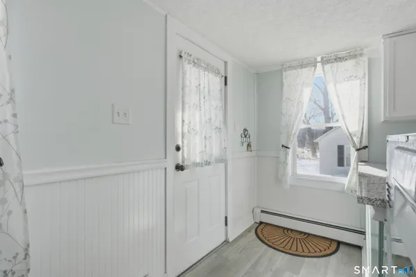a kitchen with a sink cabinets and refrigerator