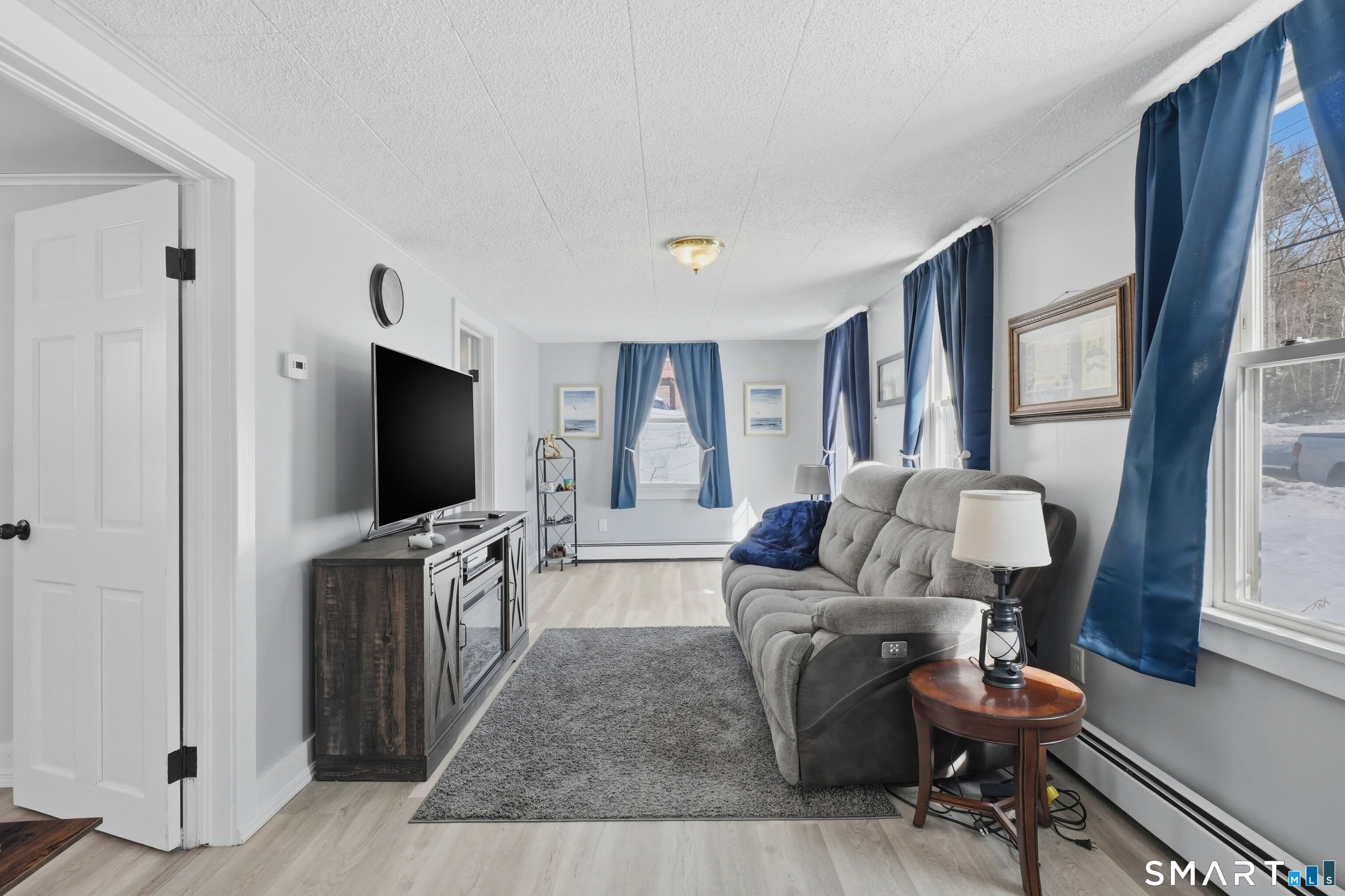 74 Riverside Drive Thompson, CT 06277 - Photo 24 of 25 a living room with furniture and a flat screen tv