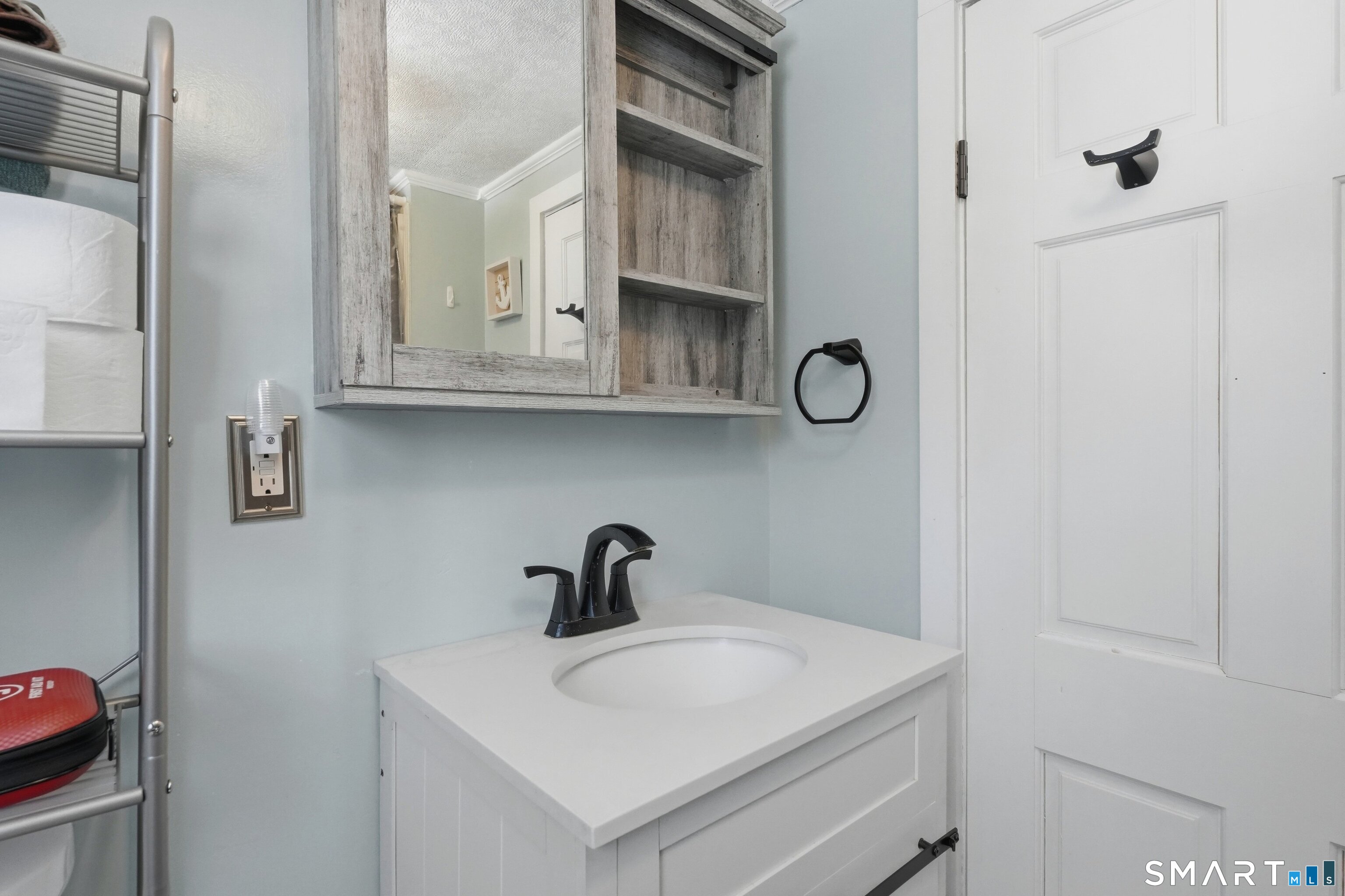 74 Riverside Drive Thompson, CT 06277 - Photo 25 of 25 a bathroom with a sink and a mirror