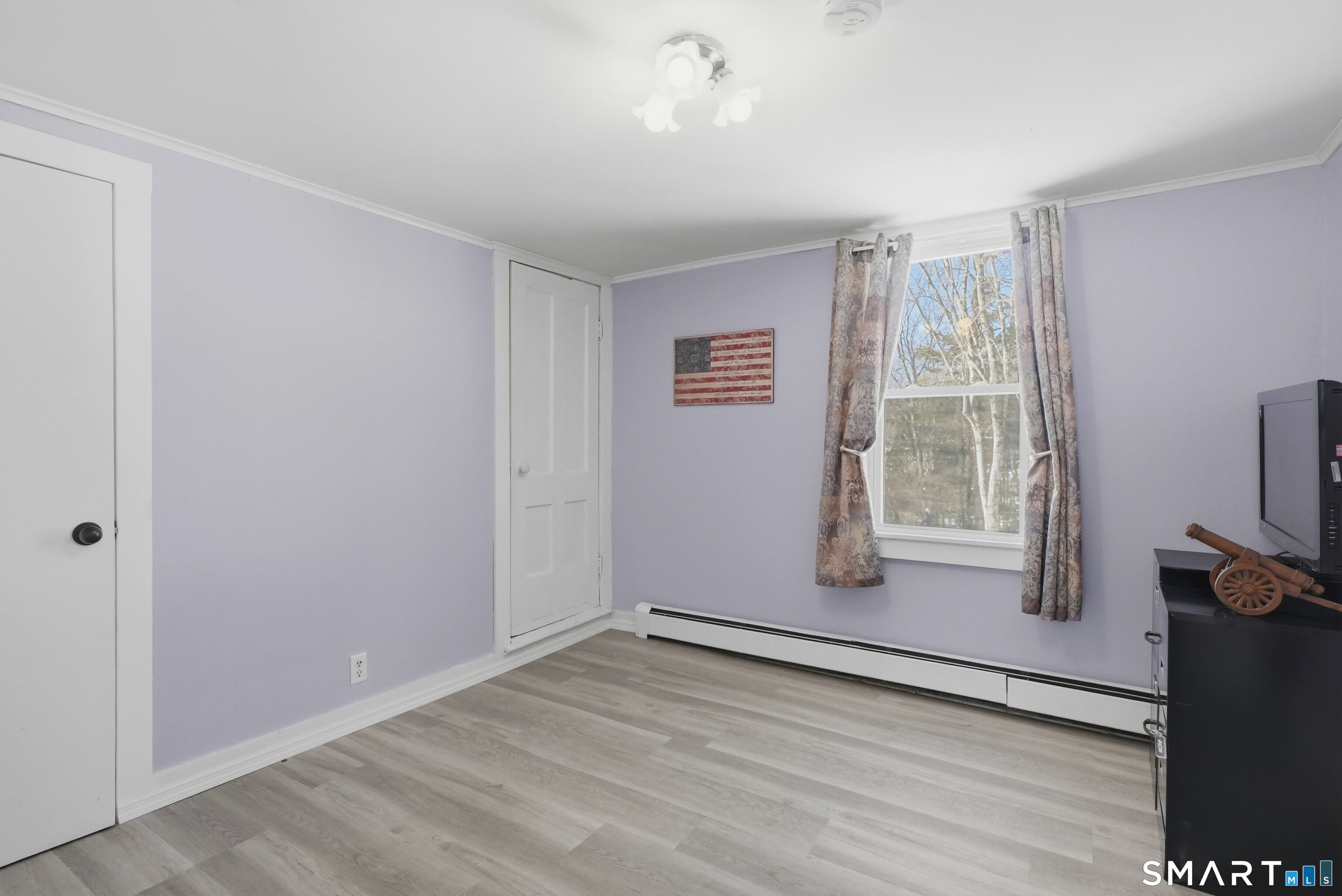 74 Riverside Drive Thompson, CT 06277 - Photo 4 of 25 wooden floor in an empty room with a window