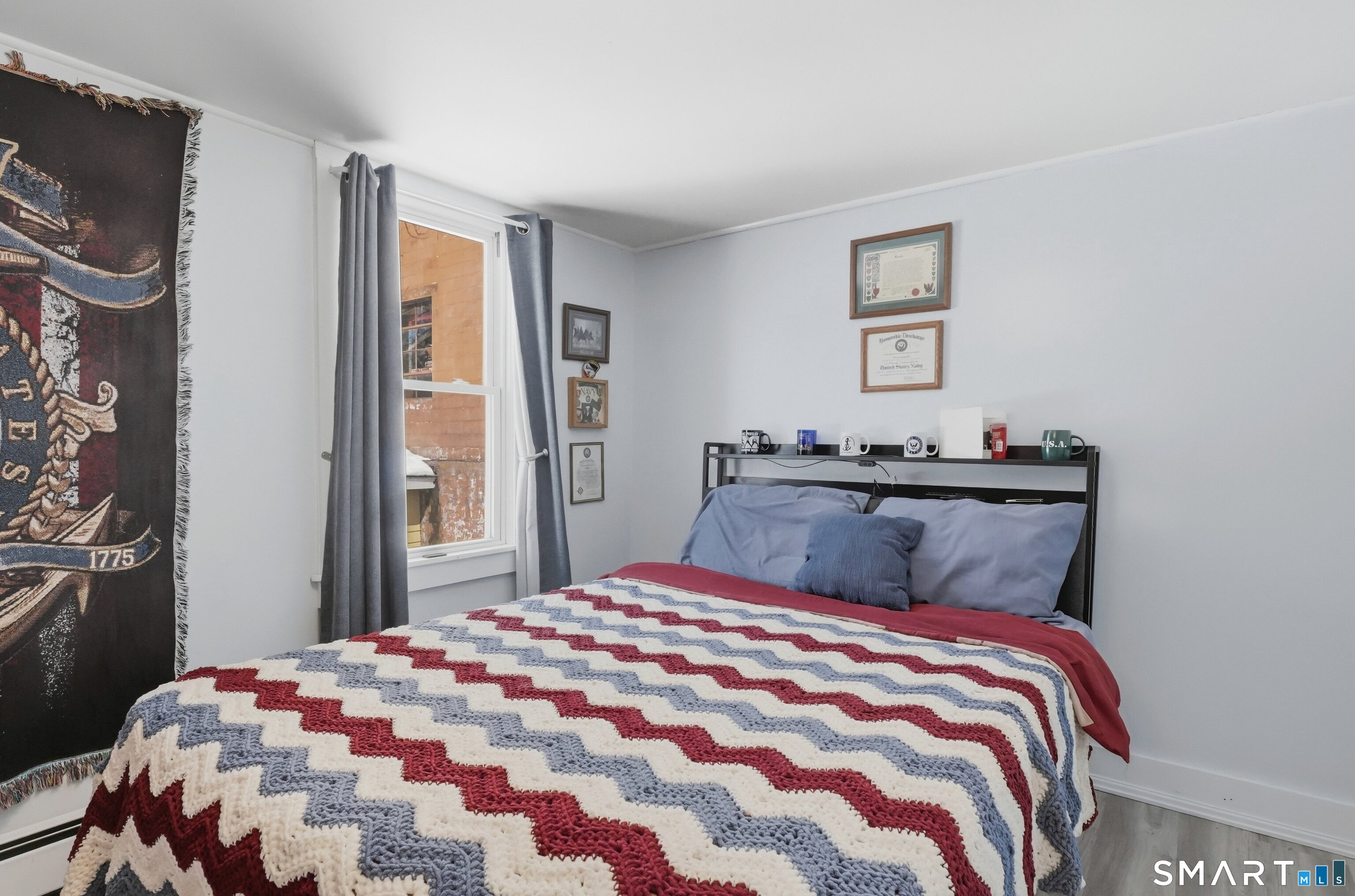 74 Riverside Drive Thompson, CT 06277 - Photo 7 of 25 a bedroom with a bed and a window