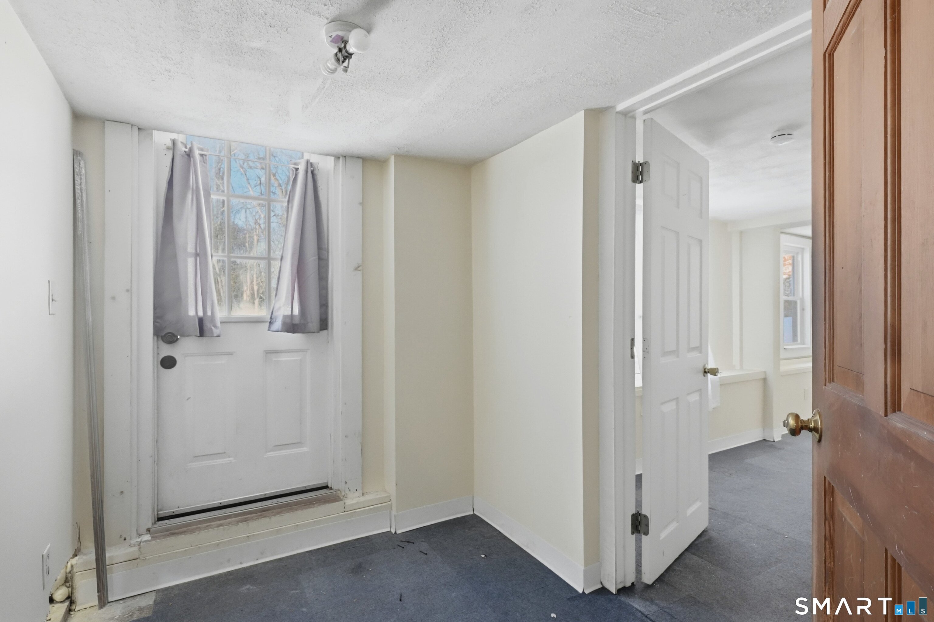 74 Riverside Drive Thompson, CT 06277 - Photo 9 of 25 a view of an empty room and window