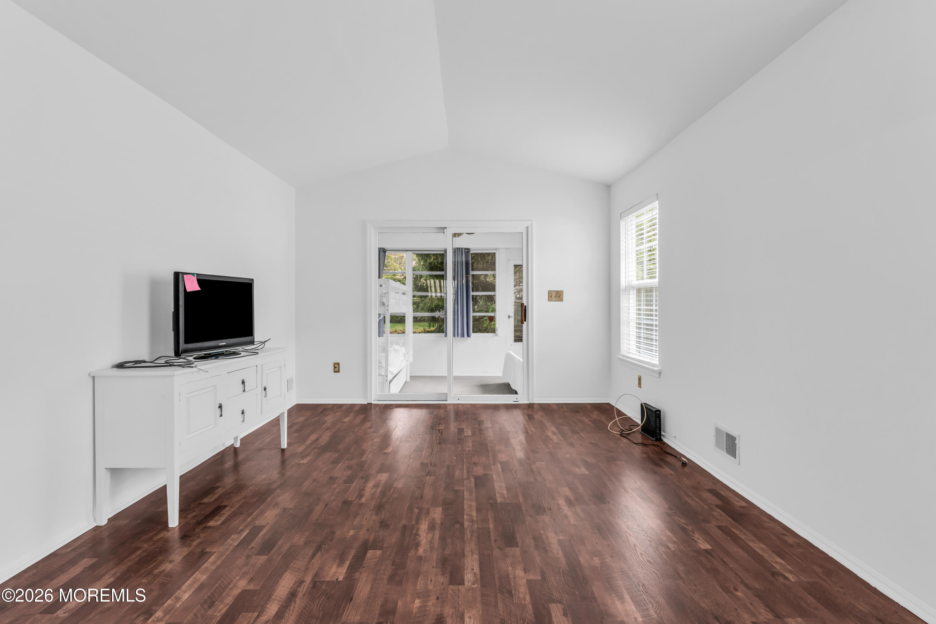 4 Brant Drive Brick, NJ 08724 - Photo 11 of 34 a view of a livingroom with wooden floor and a window