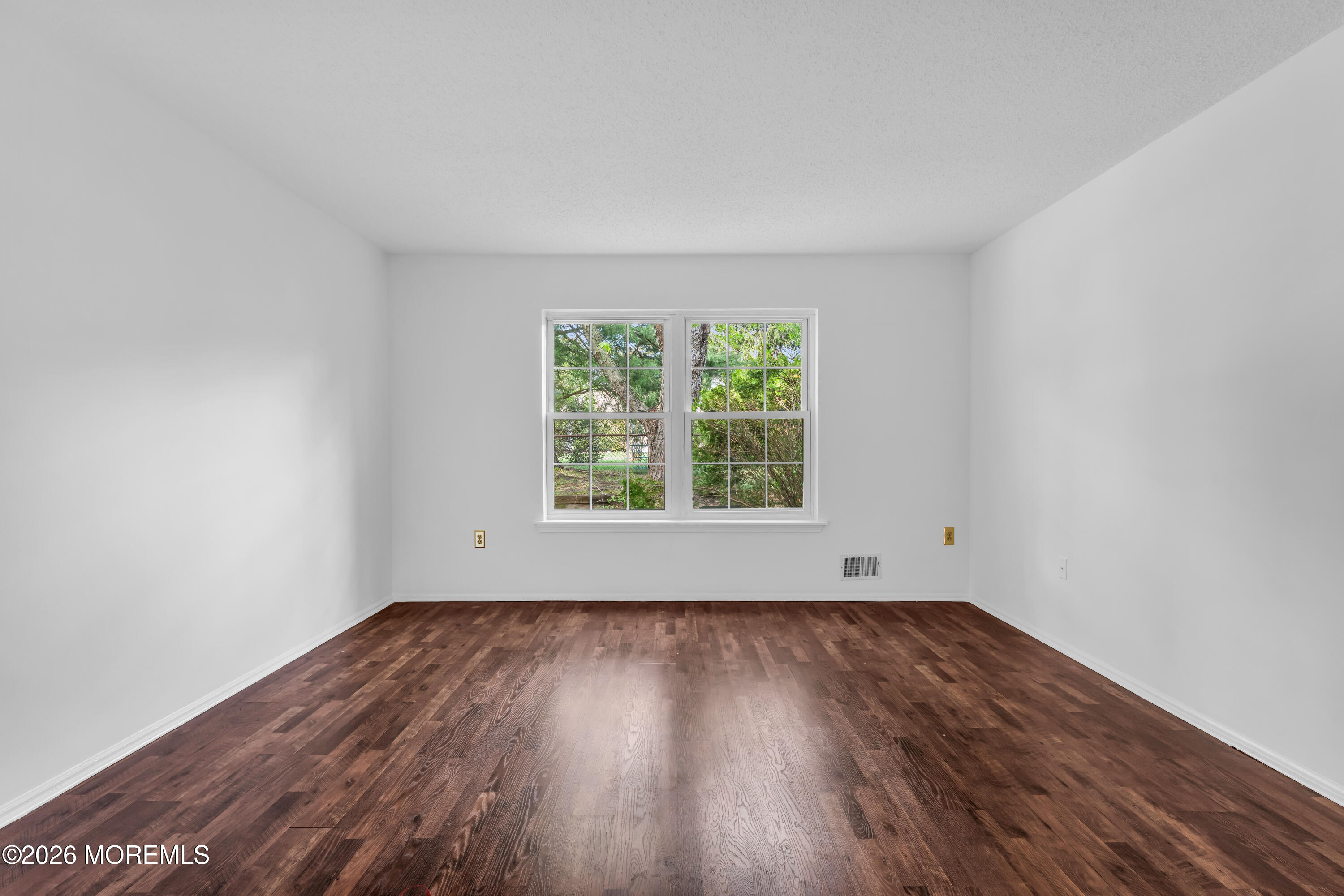 4 Brant Drive Brick, NJ 08724 - Photo 12 of 34 an empty room with wooden floor and windows