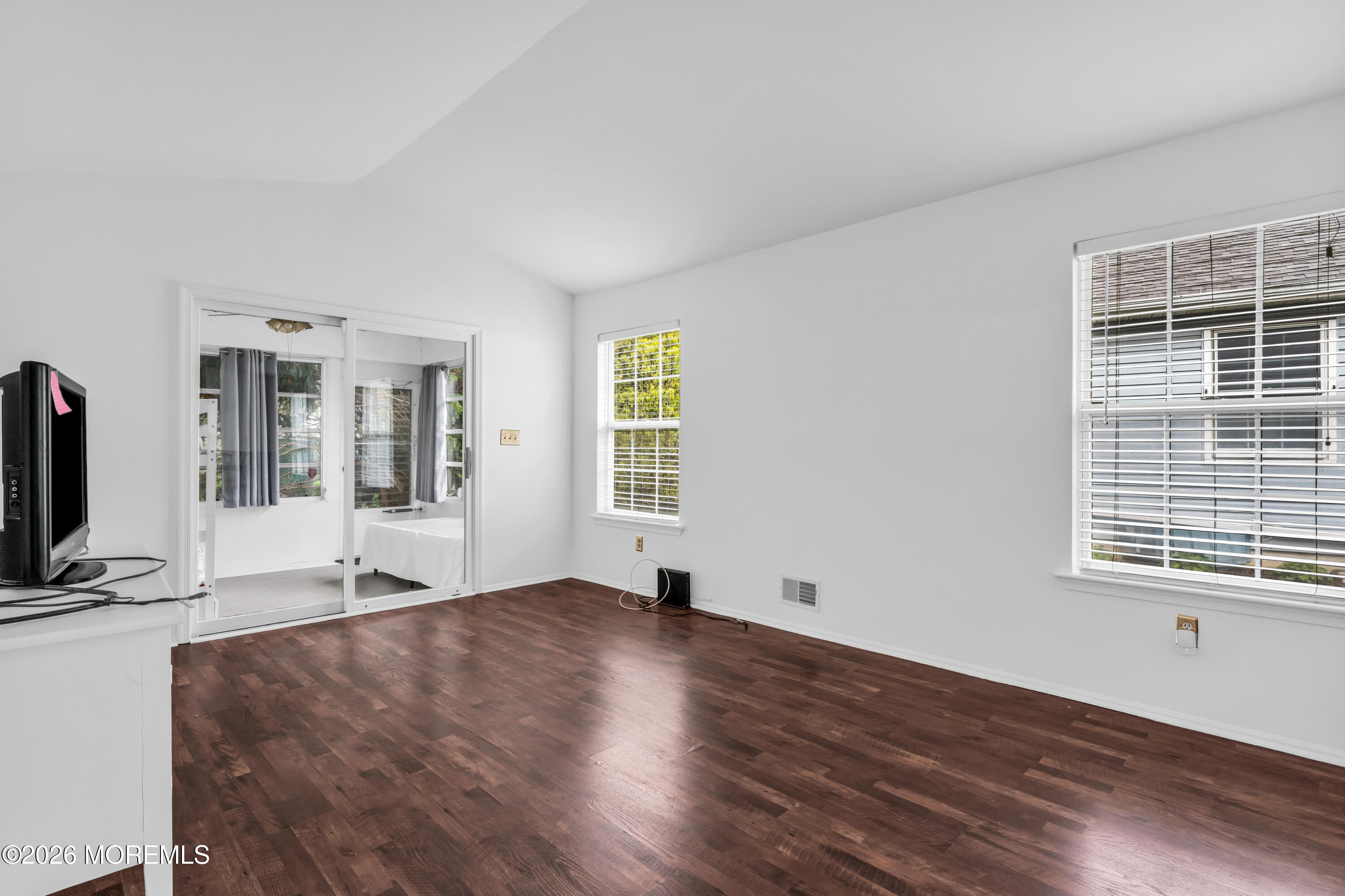 4 Brant Drive Brick, NJ 08724 - Photo 14 of 34 a view of an empty room with wooden floor and a window