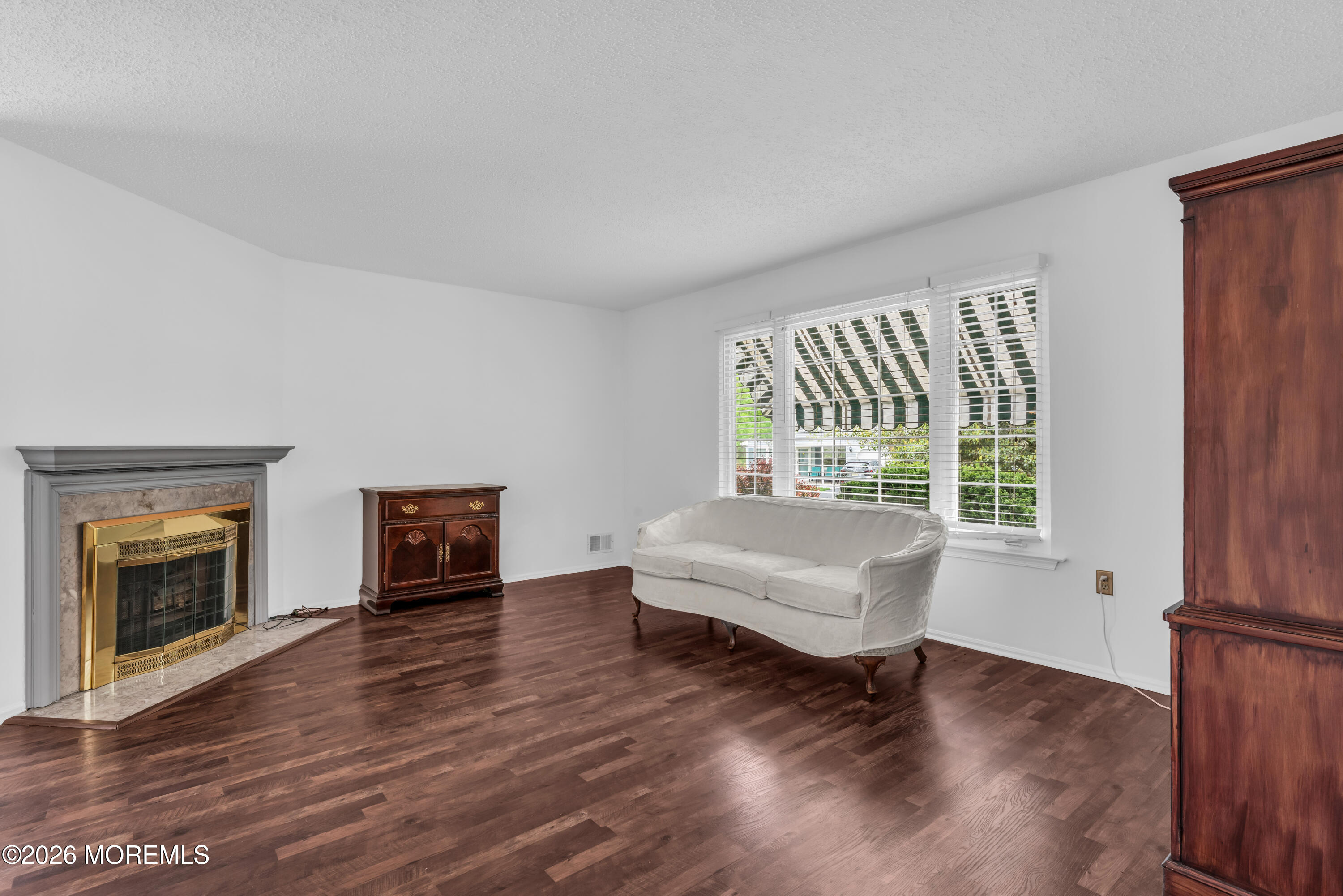 4 Brant Drive Brick, NJ 08724 - Photo 2 of 34 a living room with furniture and a fireplace