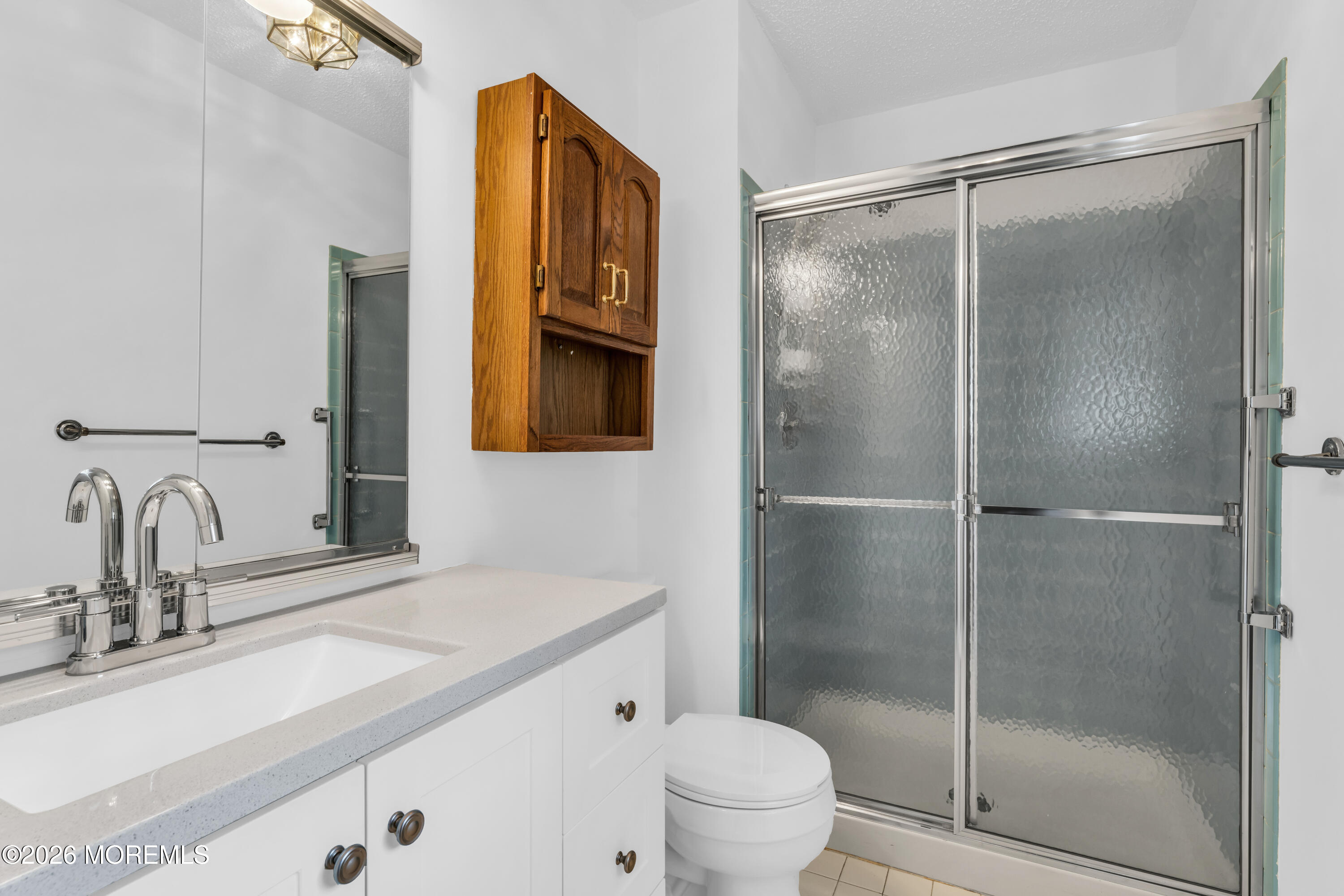 4 Brant Drive Brick, NJ 08724 - Photo 25 of 34 a bathroom with a shower sink vanity mirror and toilet