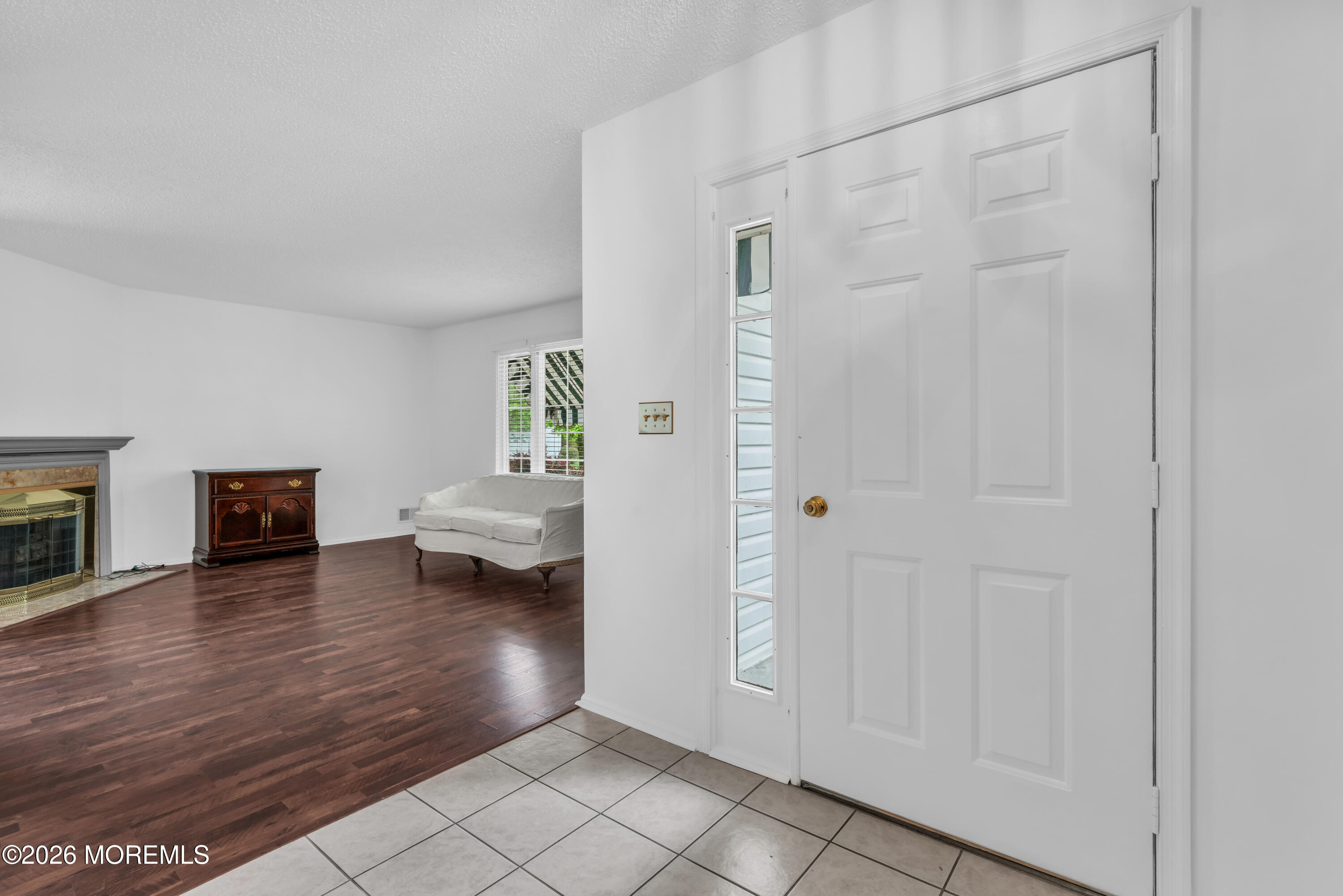 4 Brant Drive Brick, NJ 08724 - Photo 3 of 34 a view of an empty room and wooden floor