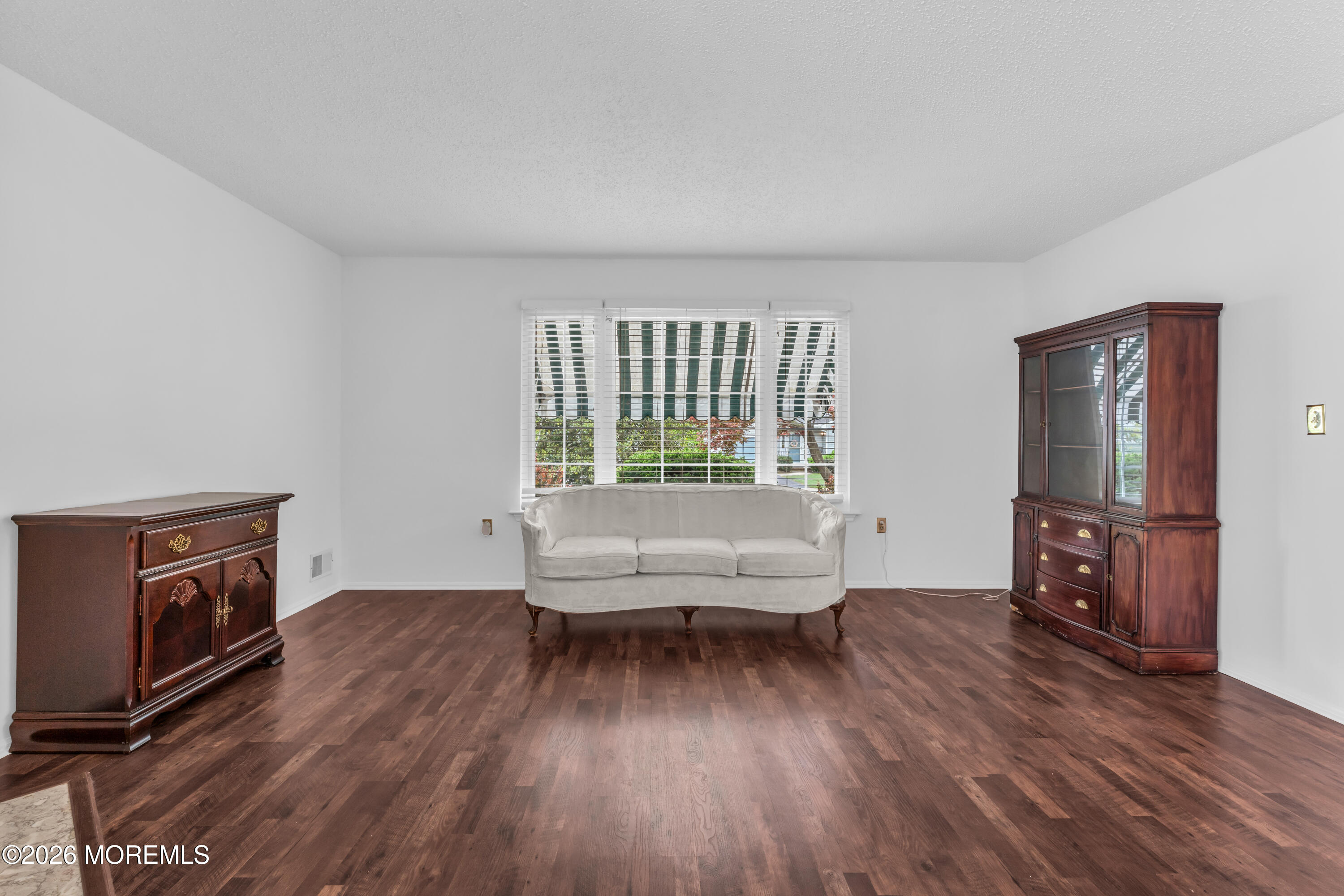 4 Brant Drive Brick, NJ 08724 - Photo 10 of 34 a living room with furniture and a wooden floor