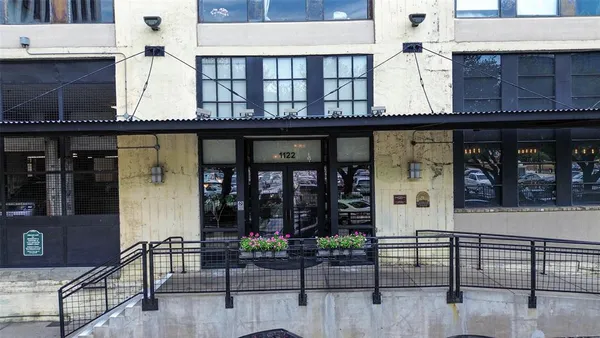 a view of a cafe with sitting area