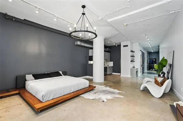 a bedroom with a bed and ceiling fan