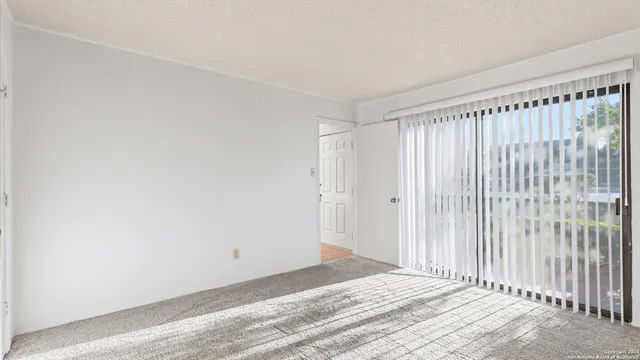 a view of a livingroom with wooden floor