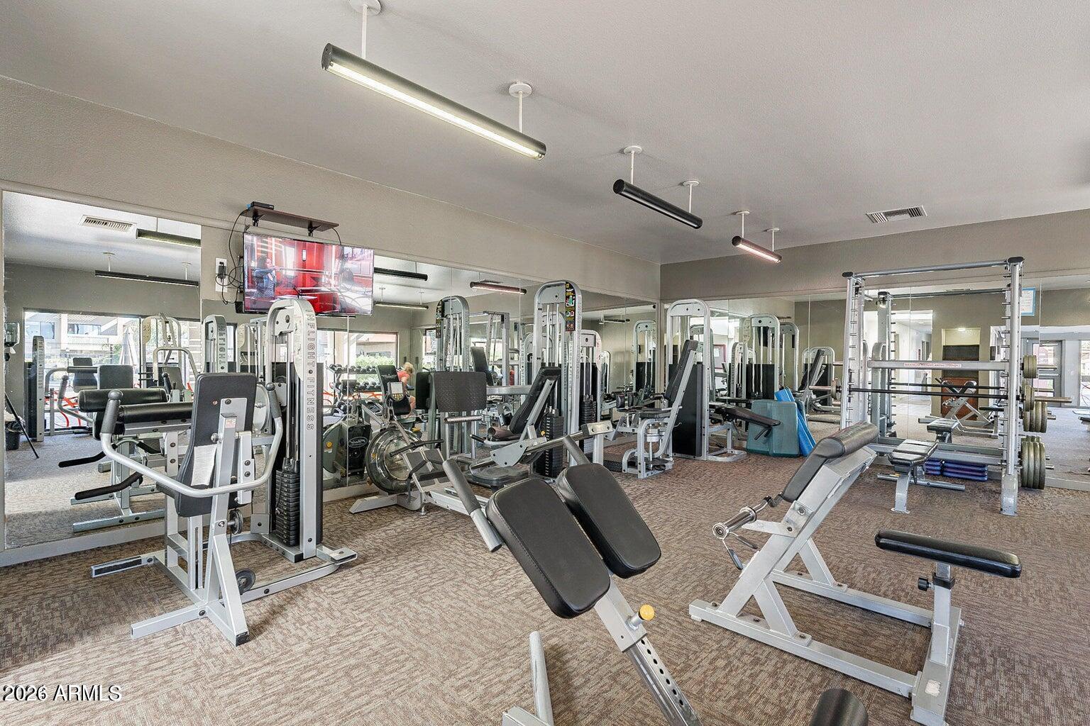 3600 North Hayden Road, Unit 3410 Scottsdale, AZ 85251 - Photo 15 of 22 a view of a room with gym equipment