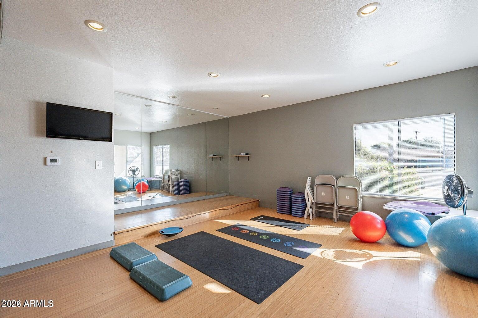 3600 North Hayden Road, Unit 3410 Scottsdale, AZ 85251 - Photo 17 of 22 a room with furniture and a flat screen tv