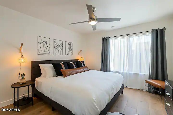 3600 North Hayden Road, Unit 3410 Scottsdale, AZ 85251 - Photo 5 of 22 a bedroom with a bed and a window